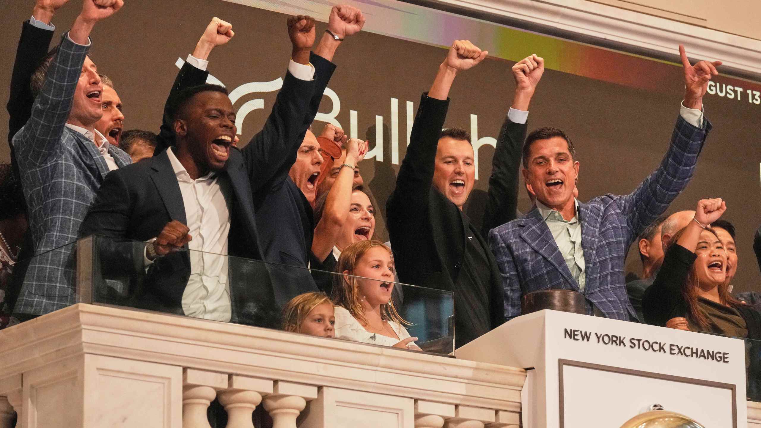 Bullish CEO Tom Farley, right, leads a cheer during opening bell ceremonies of the New York Stock Exchange, Wednesday, Aug. 13, 2025. (AP Photo/Richard Drew)