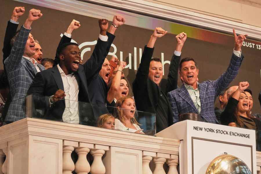 Bullish CEO Tom Farley, right, leads a cheer during opening bell ceremonies of the New York Stock Exchange, Wednesday, Aug. 13, 2025. (AP Photo/Richard Drew)