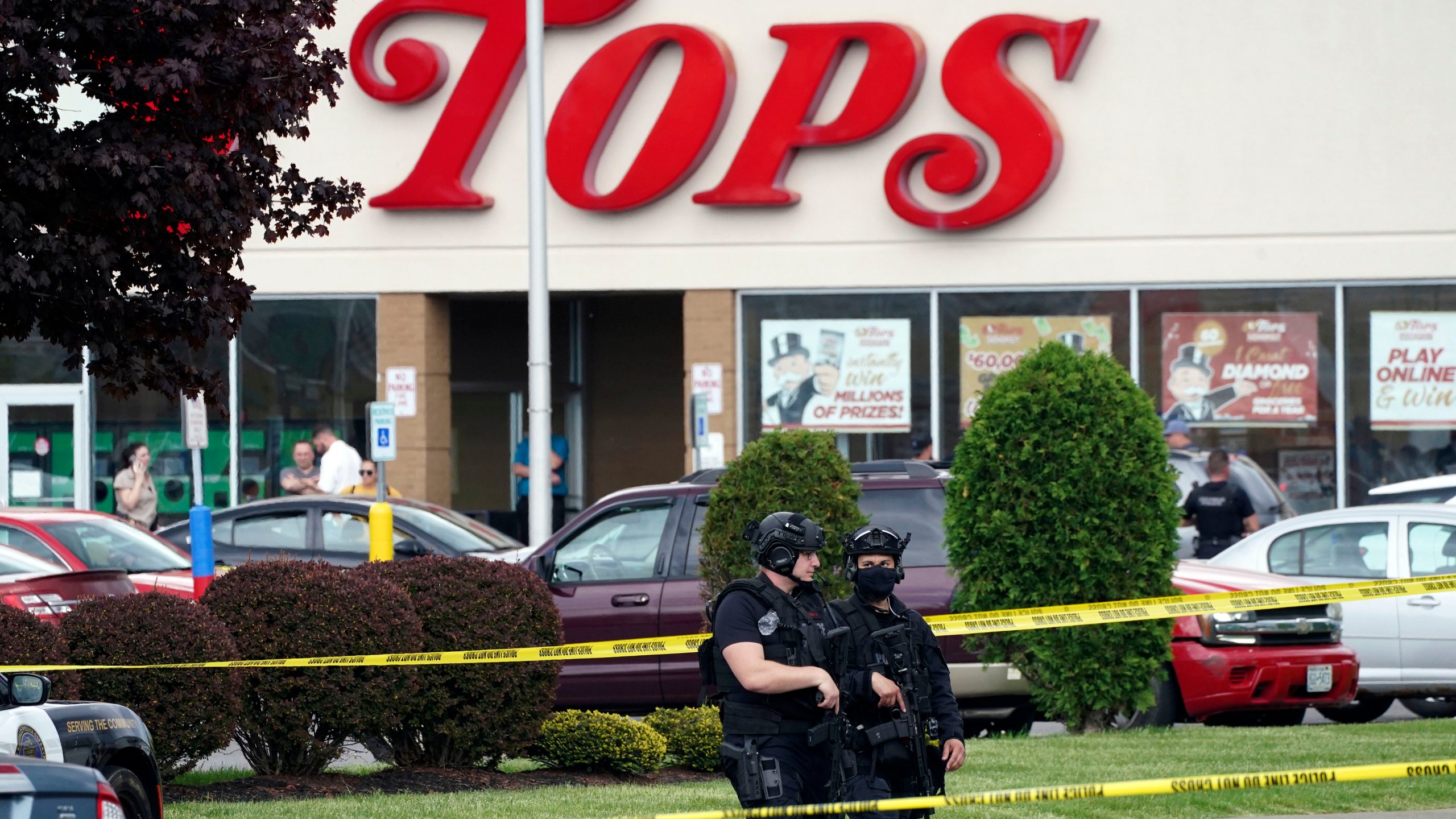 FILE - Police secure an area around a supermarket where several people were killed in a shooting, May 14, 2022 in Buffalo, N.Y. Relatives of victims of a racist mass shooting at a Buffalo supermarket have been called to federal court Friday, Jan. 12, 2024 for a "substantial update" in the legal case against Payton Gendron, their attorney said. (Derek Gee/The Buffalo News via AP, File)