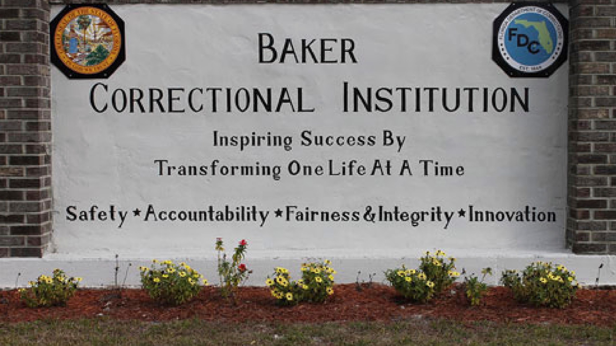 This undated image provided by the Florida Department of Corrections shows signage for the Baker Correctional Institution, a state prison about 43 miles (69 kilometers) west of downtown Jacksonville, Fla. (Florida Department of Corrections via AP)