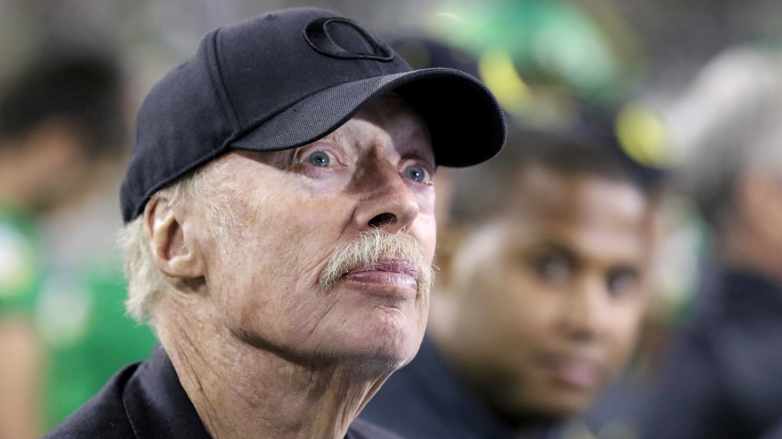 FILE - In this Sept. 26, 2015, file photo, Nike co-founder Phil Knight watches from the sidelines during the second half of an NCAA college football game between Oregon and Utah in Eugene, Ore. (AP Photo/Ryan Kang, File)