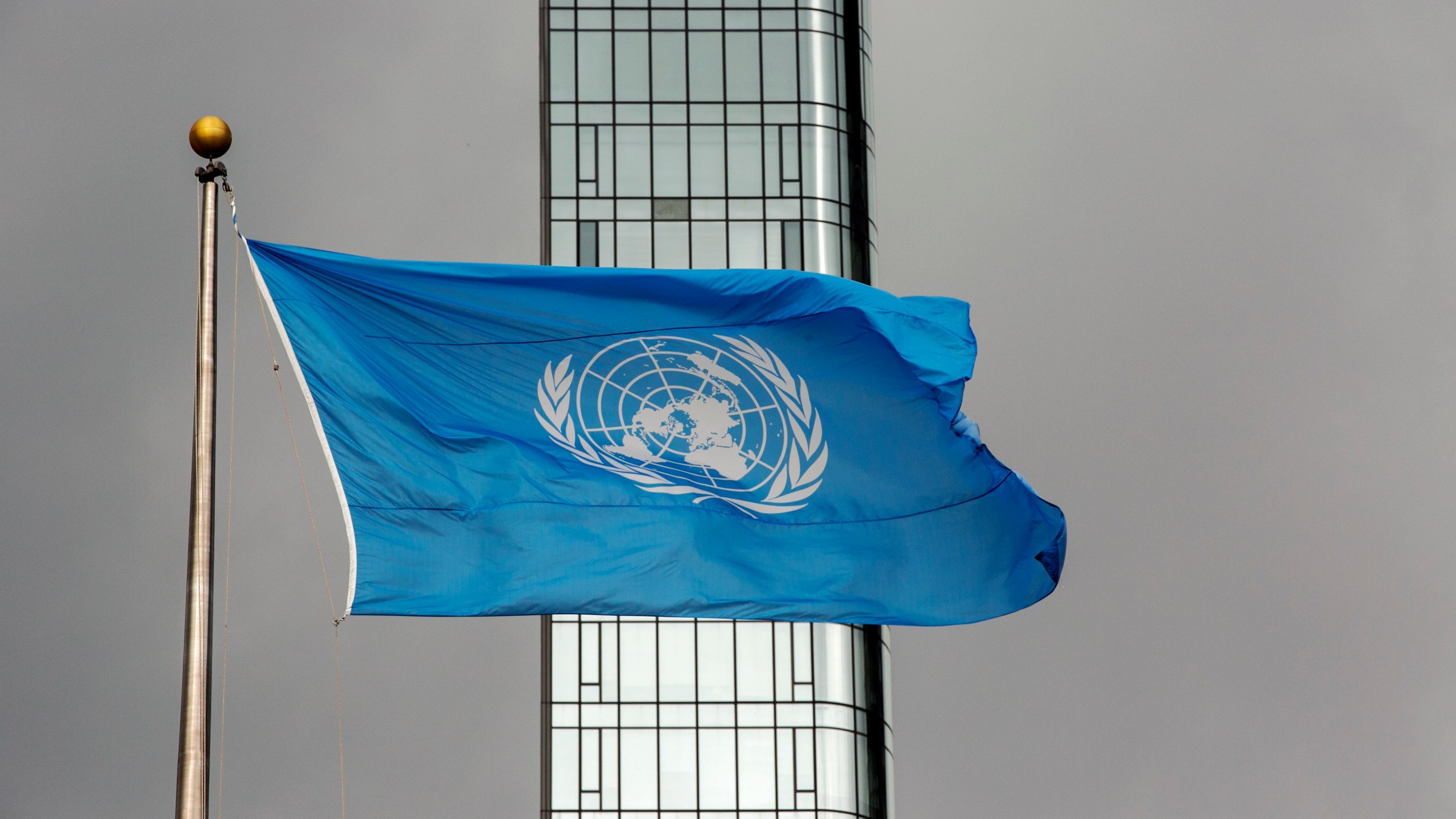 FILE - The UN flag flies on a stormy day at the United Nations during the United Nations General Assembly on Sept. 22, 2022. (AP Photo/Ted Shaffrey, File)