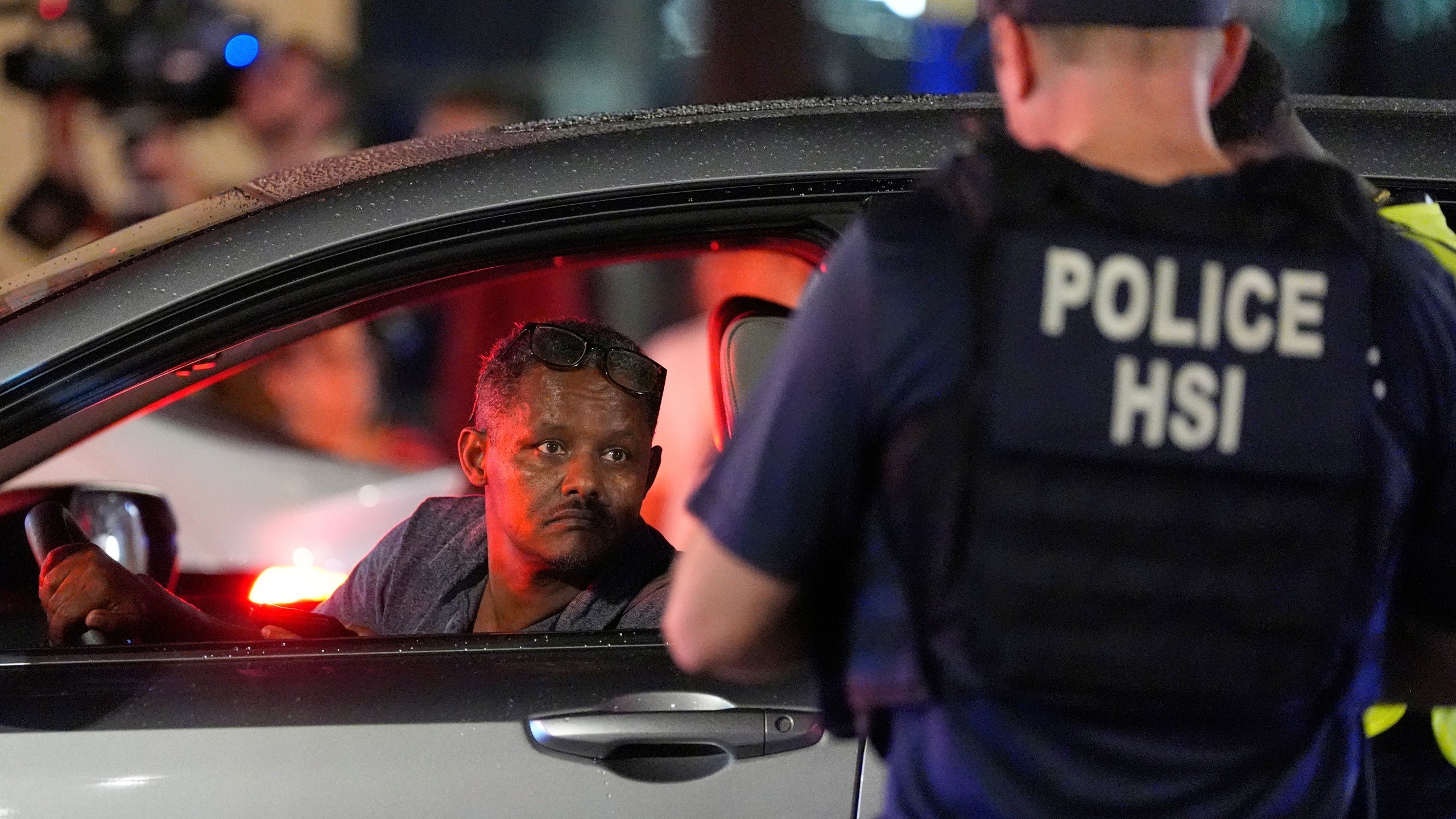 Department of Homeland Security Investigations agents join Washington Metropolitan Police Department officers as they conduct traffic checks at a checkpoint along 14th Street in northwest Washington, Wednesday, Aug. 13, 2025, in Washington. (AP Photo/Alex Brandon)