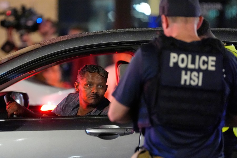Department of Homeland Security Investigations agents join Washington Metropolitan Police Department officers as they conduct traffic checks at a checkpoint along 14th Street in northwest Washington, Wednesday, Aug. 13, 2025, in Washington. (AP Photo/Alex Brandon)