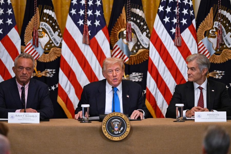 President Donald Trump speaks at an event to promote his proposal to improve Americans' access to their medical records, in the East Room of the White House, Wednesday, July 30, 2025, in Washington, as Health and Human Service Secretary Robert F. Kennedy, Jr., left, and Administrator of the Centers for Medicare and Medicaid Services, Mehmet Oz, right, look on. (AP Photo/John McDonnell)