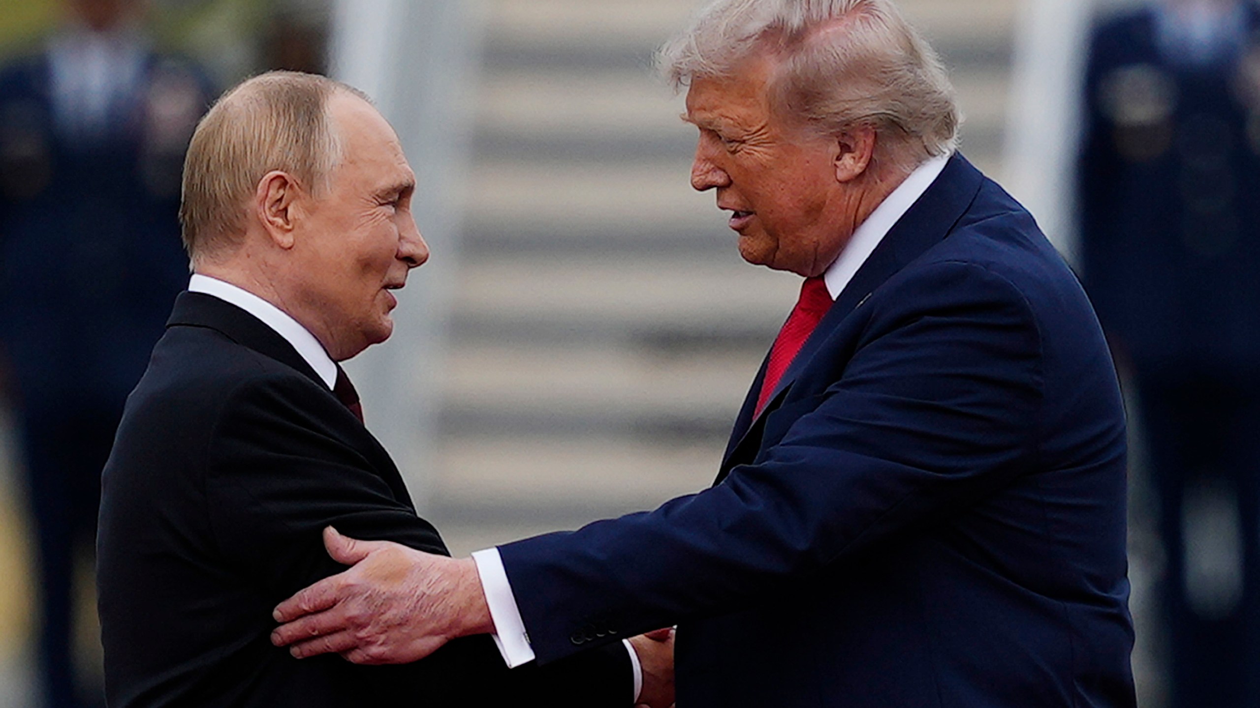 President Donald Trump greets Russia's President Vladimir Putin Friday, Aug. 15, 2025, at Joint Base Elmendorf-Richardson, Alaska. (AP Photo/Julia Demaree Nikhinson)