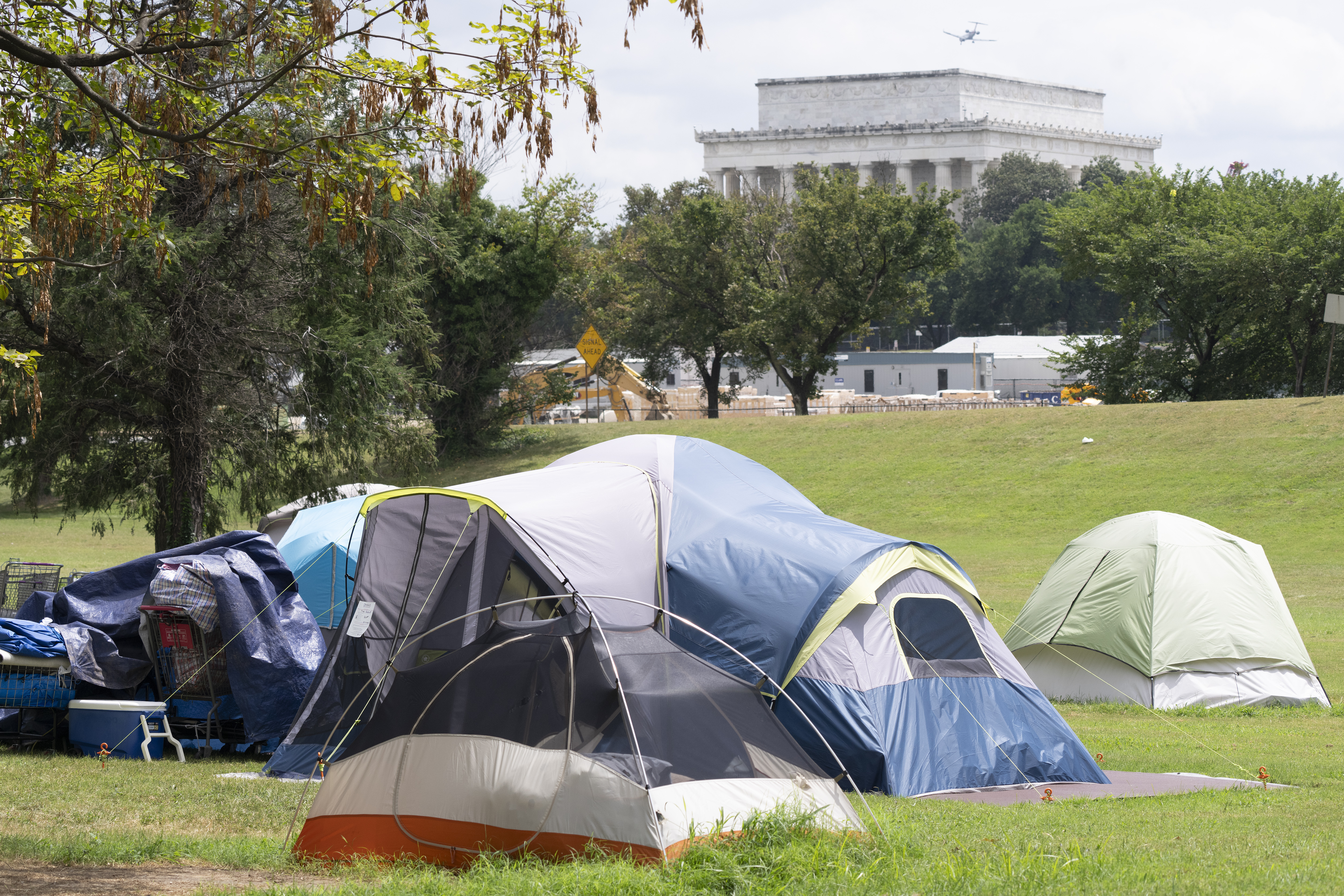 A homeless encampment is seen near the Lincoln Memorial as President Donald Trump uses federal law enforcement and the National Guard eliminate violent crime and unhoused people from the nation's capital, in Washington, Wednesday, Aug. 13, 2025. (AP Photo/J. Scott Applewhite)