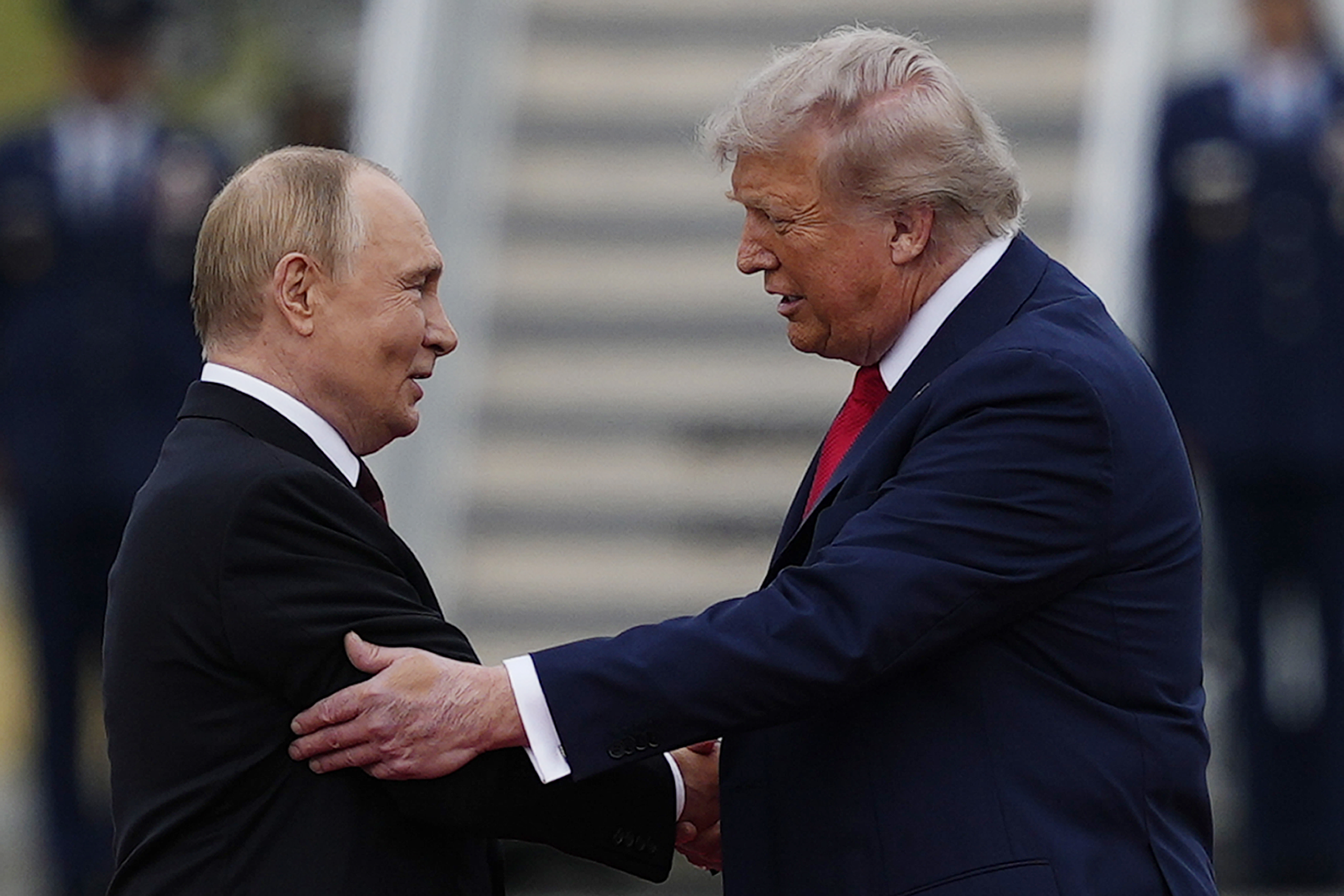 President Donald Trump greets Russia's President Vladimir Putin Friday, Aug. 15, 2025, at Joint Base Elmendorf-Richardson, Alaska. (AP Photo/Julia Demaree Nikhinson)