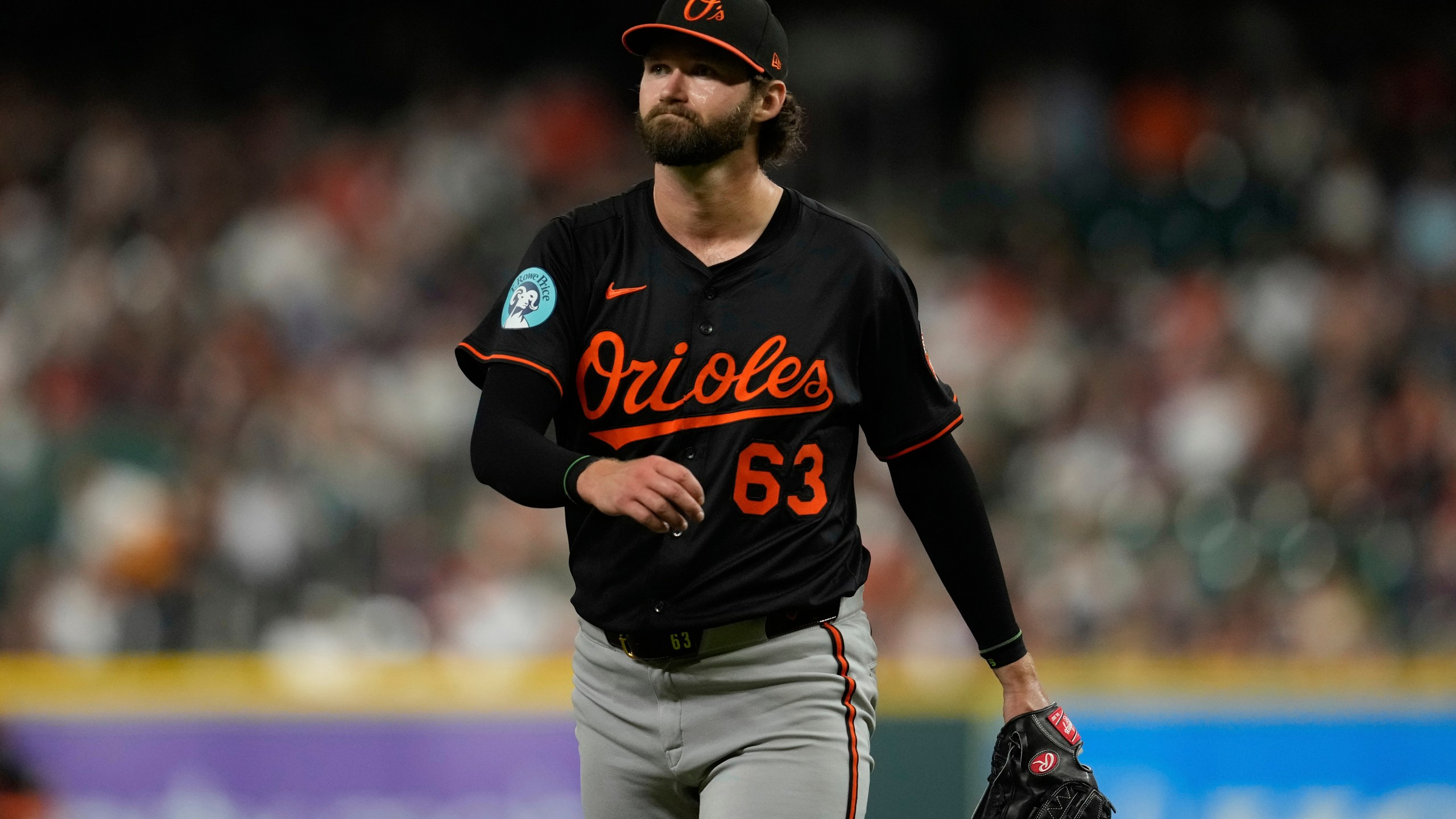 Baltimore Orioles starting pitcher Brandon Young returns to the dugout after the eighth inning of a baseball game against the Houston Astros in Houston, Friday, Aug. 15, 2025. (AP Photo/Ashley Landis)