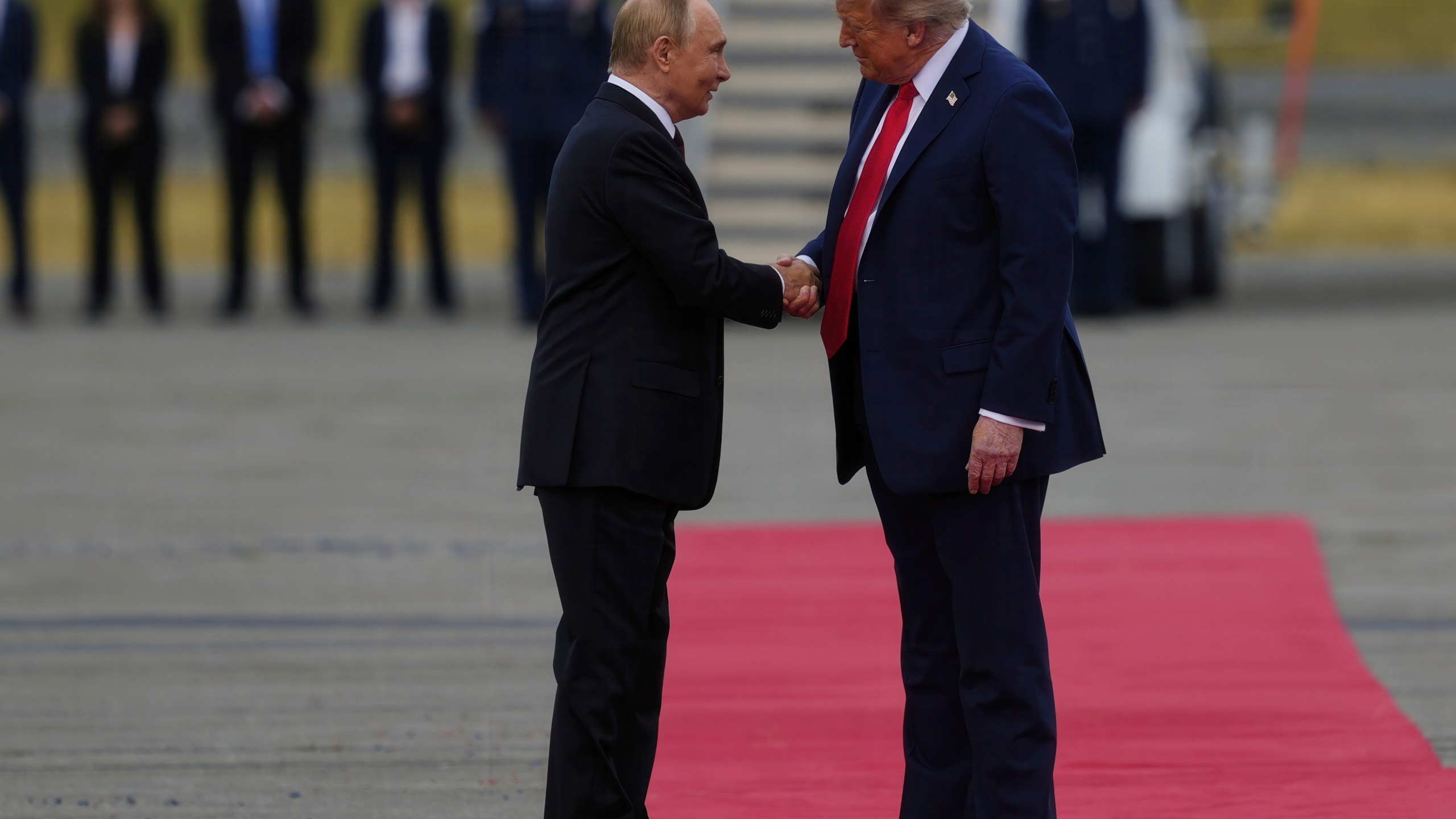 President Donald Trump greets Russia's President Vladimir Putin Friday, Aug. 15, 2025, at Joint Base Elmendorf-Richardson, Alaska. (AP Photo/Julia Demaree Nikhinson)
