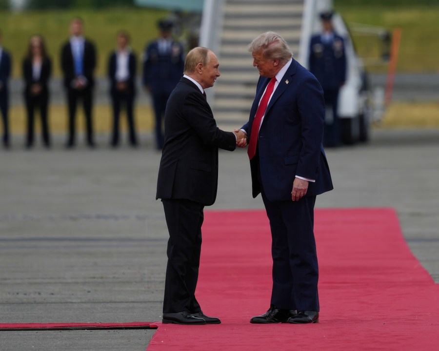 President Donald Trump greets Russia's President Vladimir Putin Friday, Aug. 15, 2025, at Joint Base Elmendorf-Richardson, Alaska. (AP Photo/Julia Demaree Nikhinson)