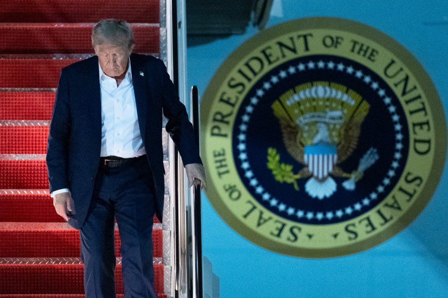 President Donald Trump disembarks Air Force One as he arrives at Joint Base Andrews, Md., early Saturday, Aug. 16, 2025, from a summit with Russian President Vladimir Putin in Anchorage, Alaska. (AP Photo/Manuel Balce Ceneta)