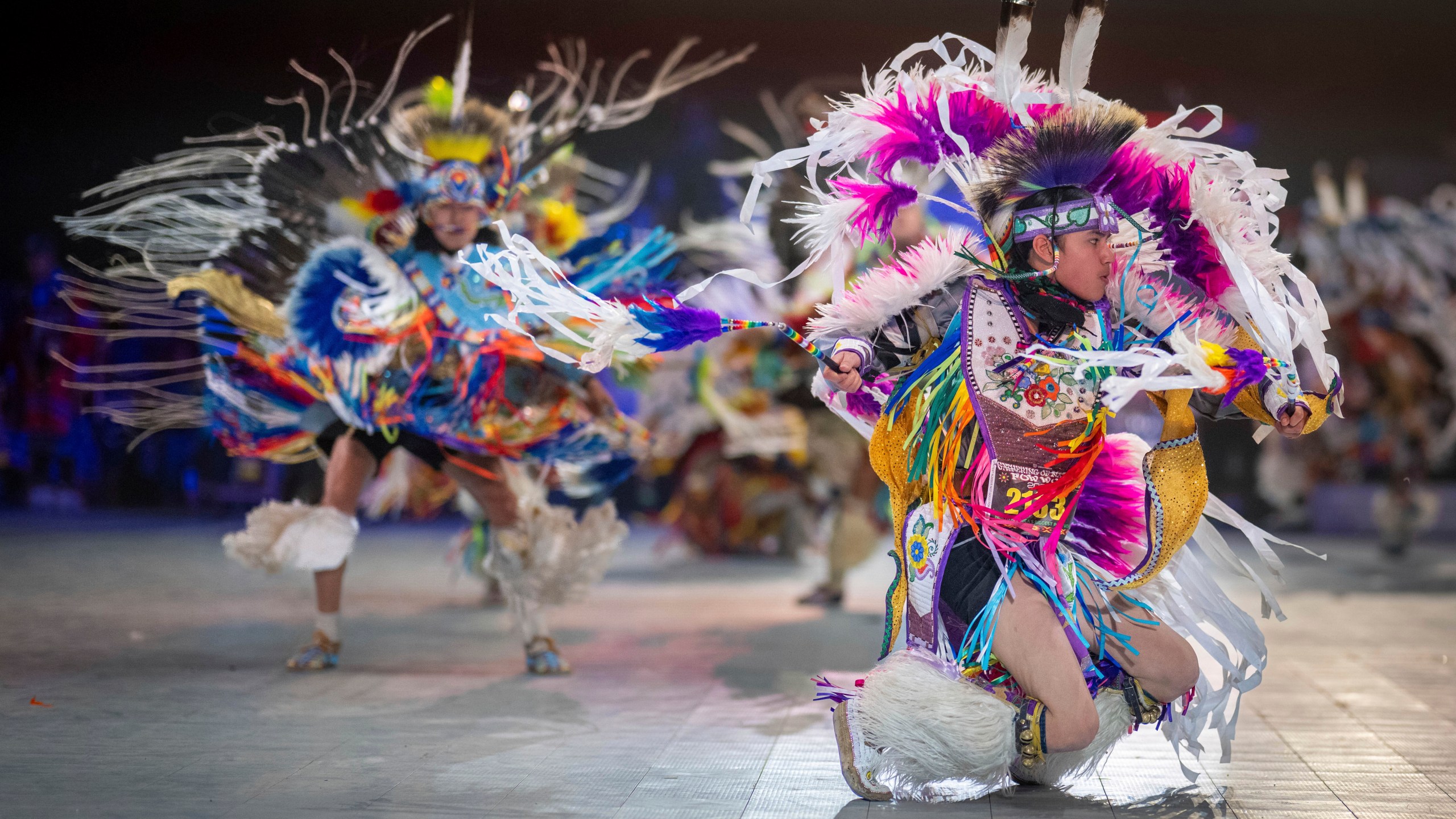 FILE - Thirteen year-old Leland Mitsuing, right, of Saskatchewan, Canada competes in the Jr. Boys Traditional competition at the 40th anniversary of the Gathering of Nations Pow Wow in Albuquerque, N.M., April 28, 2023. (AP Photo/Roberto E. Rosales, File)