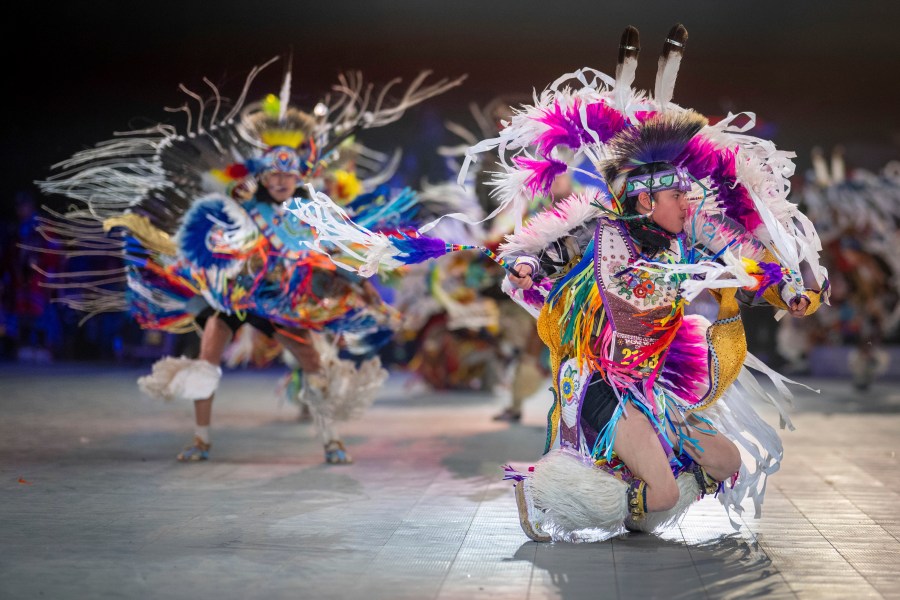 FILE - Thirteen year-old Leland Mitsuing, right, of Saskatchewan, Canada competes in the Jr. Boys Traditional competition at the 40th anniversary of the Gathering of Nations Pow Wow in Albuquerque, N.M., April 28, 2023. (AP Photo/Roberto E. Rosales, File)