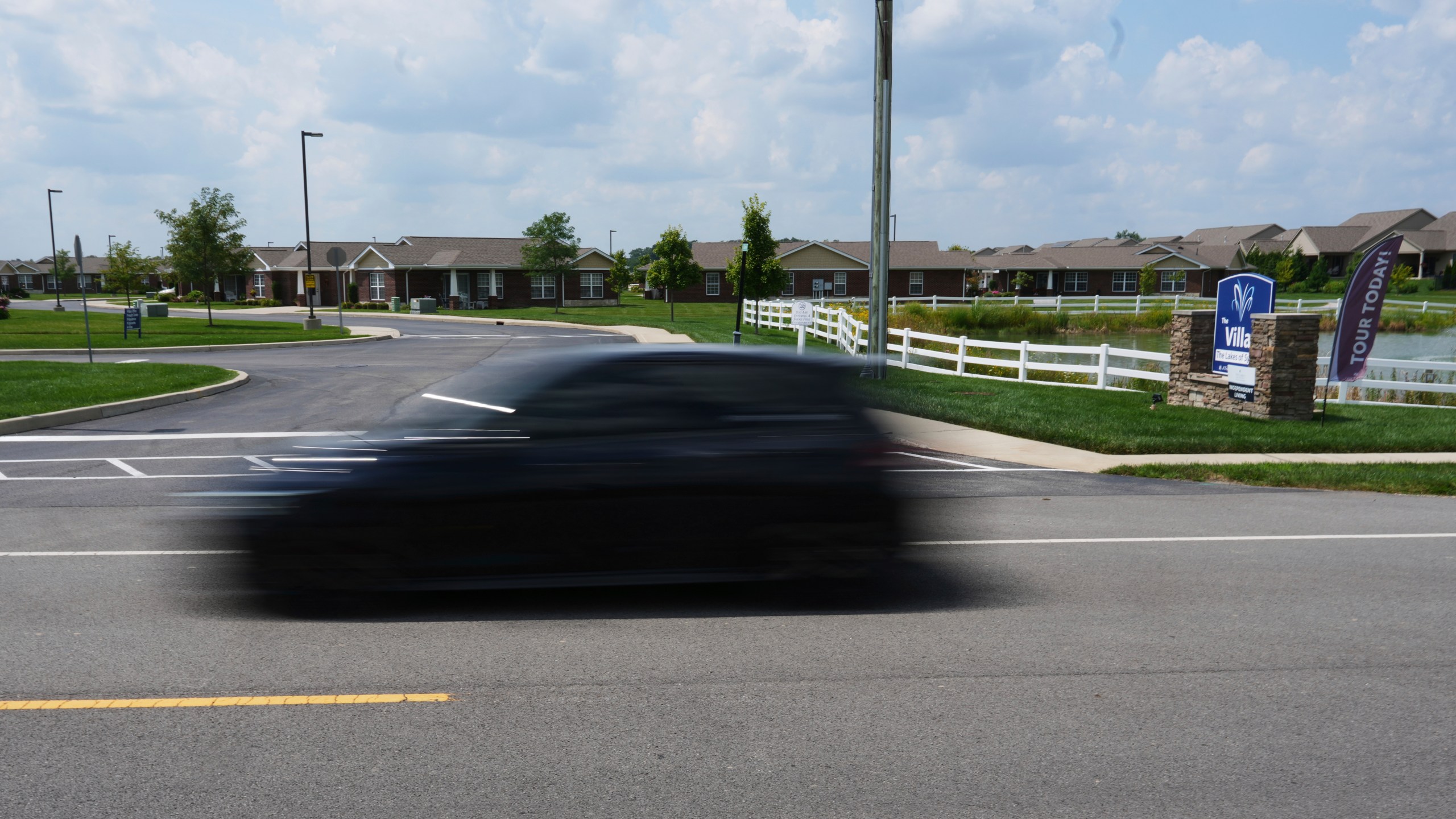 A vehicle drives on Mitchaw Road past The Lakes of Sylvania senior living community Thursday, Aug. 7, 2025, in Sylvania Township, Ohio. (AP Photo/Paul Sancya)