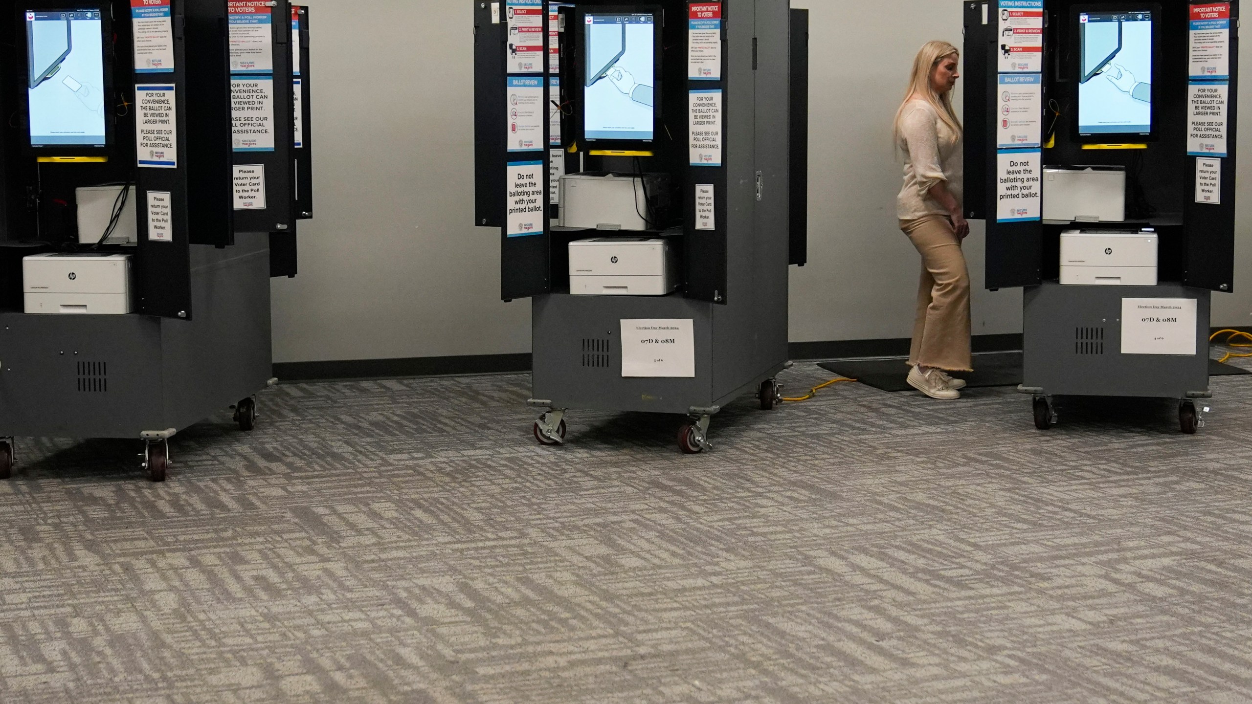 FILE - A person votes at a polling site for the presidential primary election March 12, 2024, in Atlanta. (AP Photo/Brynn Anderson, File)