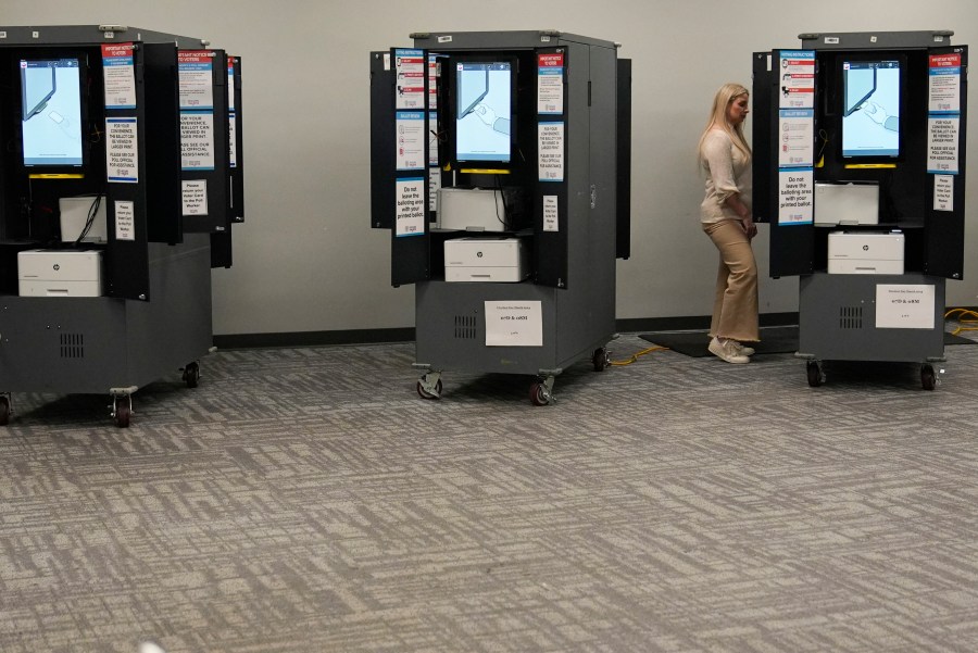 FILE - A person votes at a polling site for the presidential primary election March 12, 2024, in Atlanta. (AP Photo/Brynn Anderson, File)