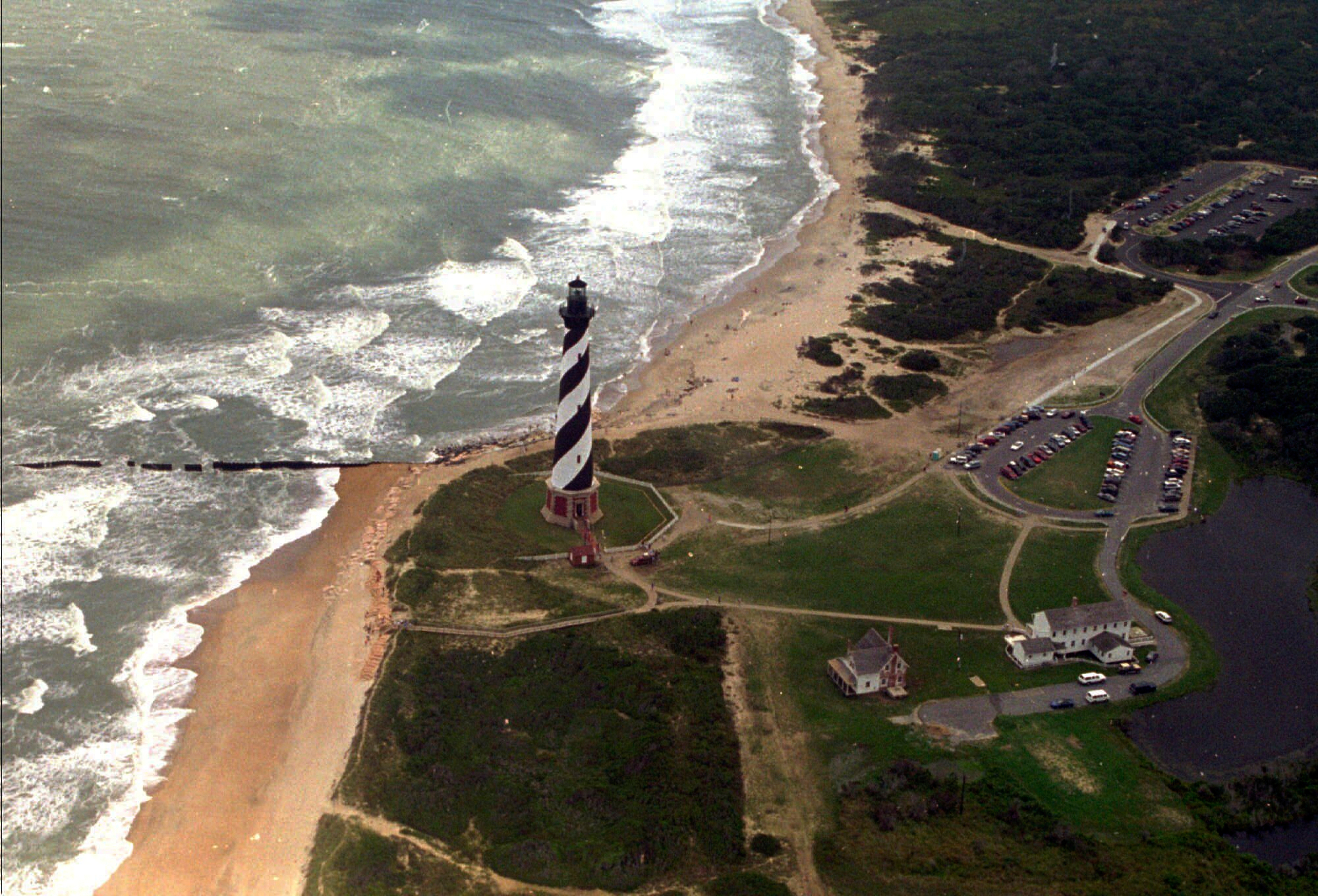 FILE - The Cape Hatteras lighthouse stands, Aug. 29, 1995 on the Outer Banks of North Carolina. (AP Photo/Ruth Fremson, File)