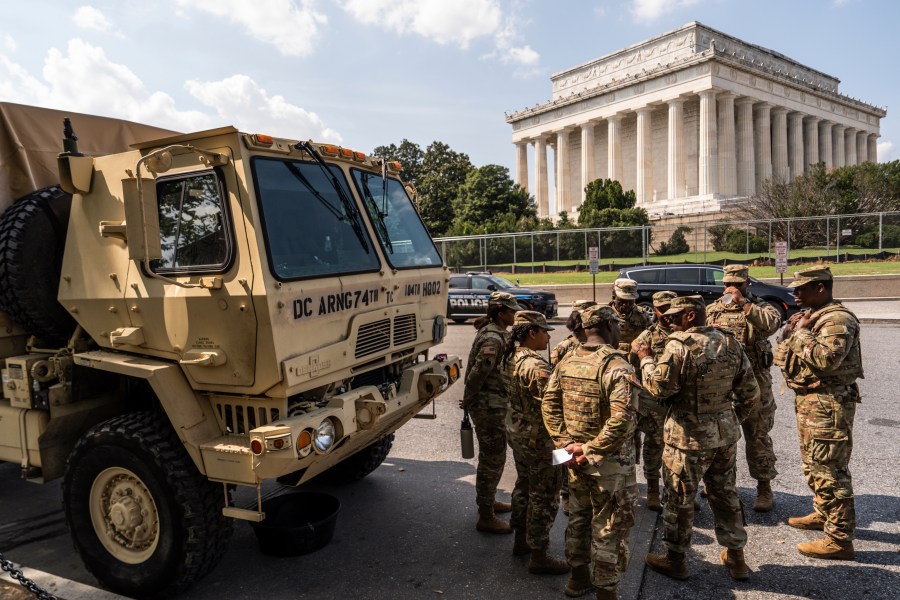 Members of the District of Columbia National Guard gather next to the Lincoln Memorial, Sunday, Aug. 17, 2025, in Washington. (AP Photo/Julia Demaree Nikhinson)