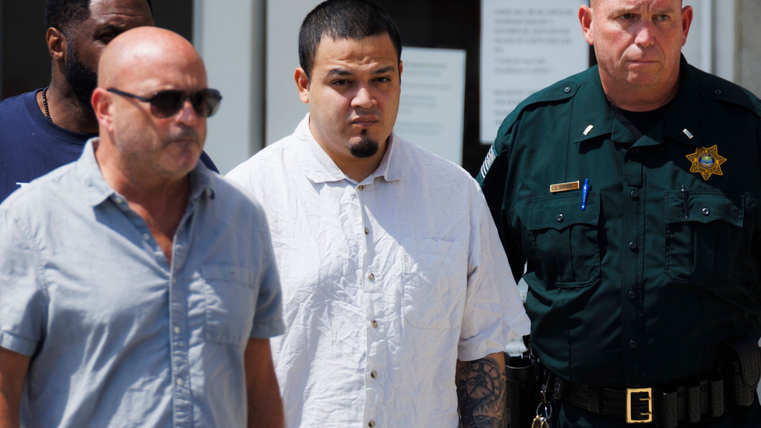 Kilmar Abrego Garcia, center, leaves the Putnam County Jail, Friday, Aug. 22, 2025, in Cookeville, Tenn. (AP Photo/Brett Carlsen)