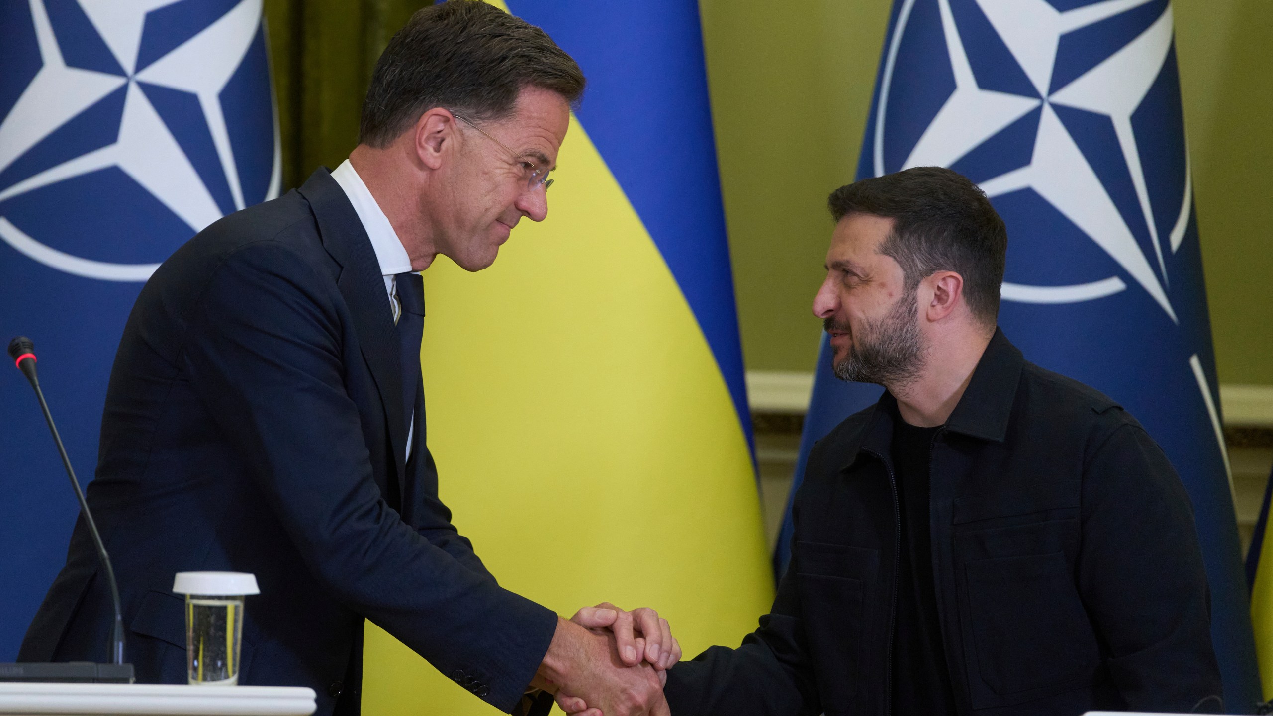 NATO Secretary General Mark Rutte, left, shakes hands with Ukrainian President Volodymyr Zelenskyy during their briefing in Kyiv, Ukraine, Friday, Aug. 22, 2025. (AP Photo/Efrem Lukatsky)