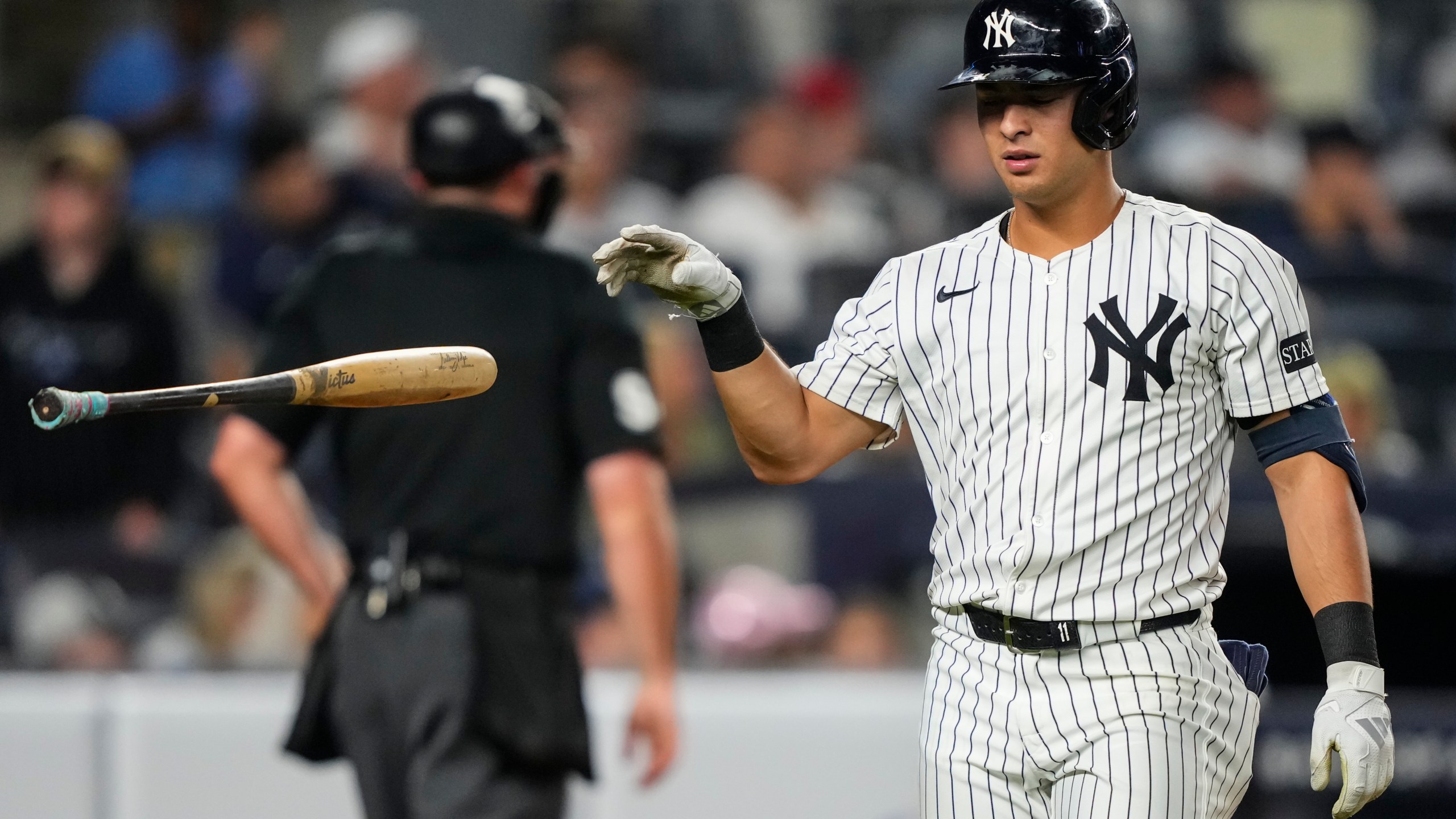 New York Yankees' Anthony Volpe (11) drops a bat after striking out during the fourth inning of a baseball game against the Minnesota Twins, Wednesday, Aug. 13, 2025, in New York. (AP Photo/Yuki Iwamura)