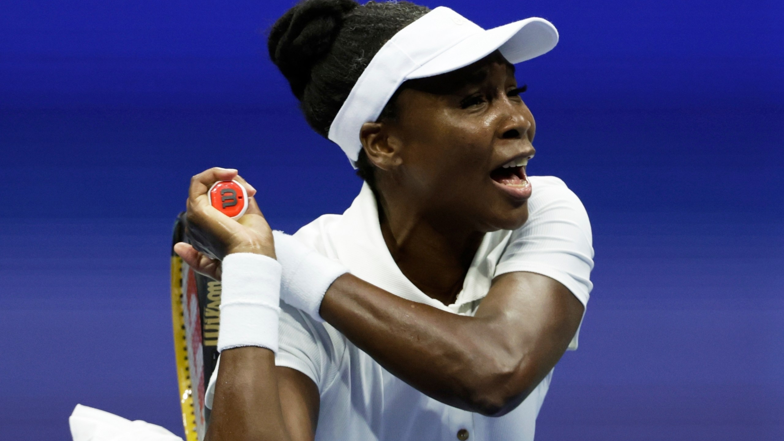 Venus Williams, of the United States, returns a shot to Karolina Muchova, of the Czech Republic, during the first round of the U.S. Open tennis championships, Monday, Aug. 25, 2025, in New York. (AP Photo/Adam Hunger)