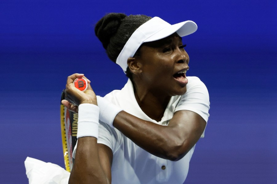 Venus Williams, of the United States, returns a shot to Karolina Muchova, of the Czech Republic, during the first round of the U.S. Open tennis championships, Monday, Aug. 25, 2025, in New York. (AP Photo/Adam Hunger)