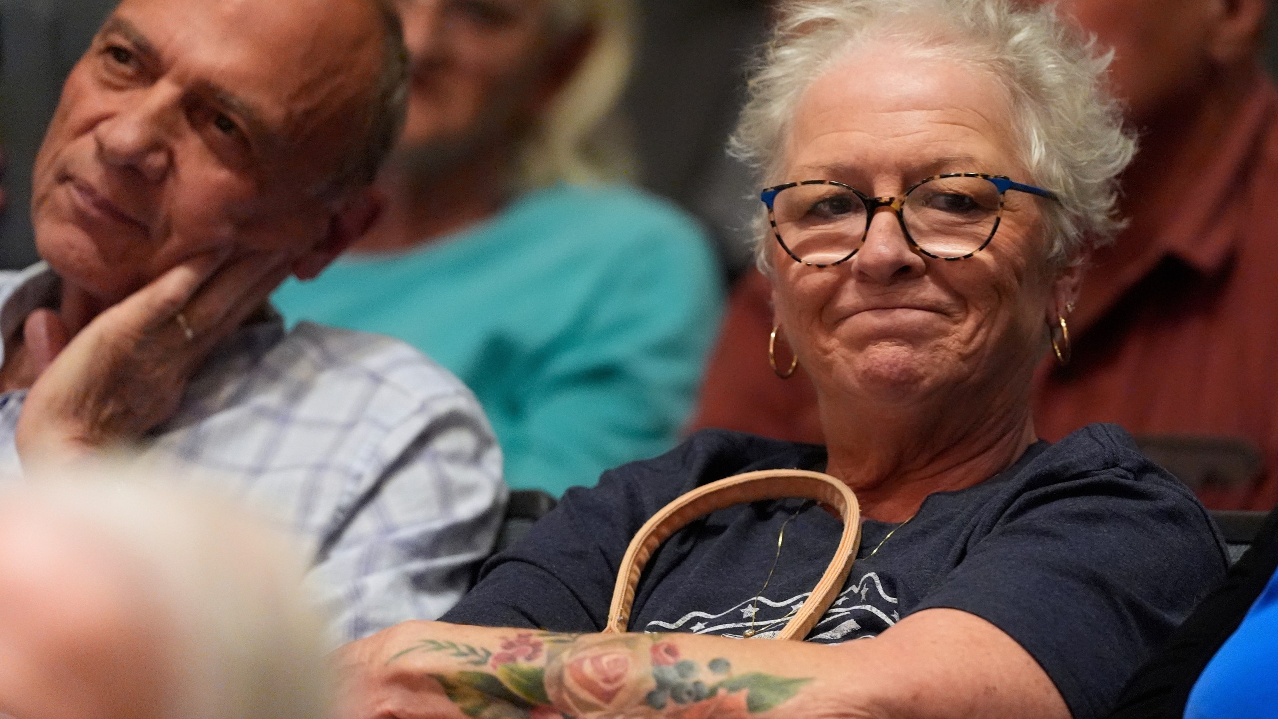 People listen as Republican Rep. Mark Alford addresses attendees at a town hall, Monday, Aug. 25, 2025, in Bolivar, Mo. (AP Photo/Charlie Riedel)