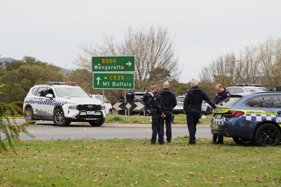 Police wait near the scene of a shooting in the high country of Porepunkah in the state of Victoria, Australia, Tuesday, Aug. 26, 2025.(Simon Dallinger/AAP Image via AP)