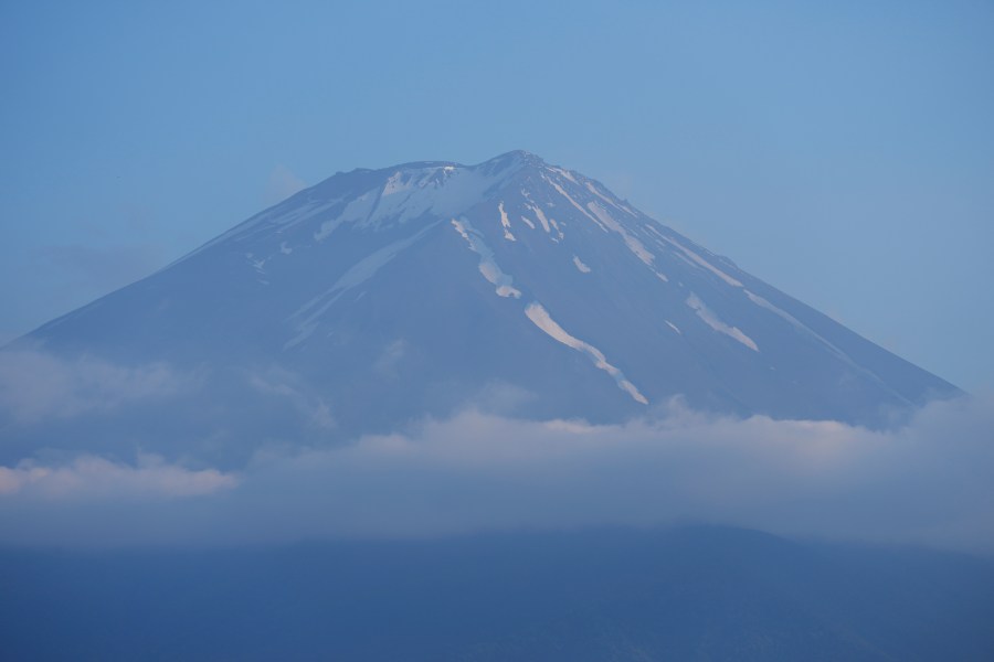 FILE - The top of Mount Fuji is seen in Fujikawaguchiko town, about 110 kilometers (68 miles) west of Tokyo, June 14, 2024. (AP Photo/Hiro Komae, File)