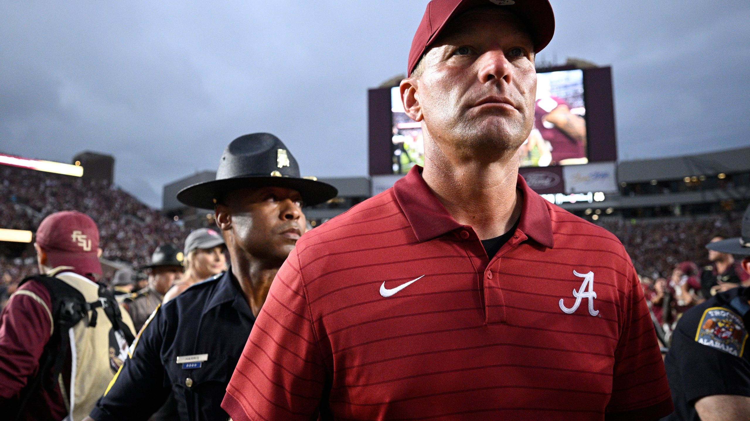 Alabama head coach Kalen DeBoer, front, leaves the field after a loss to Florida State in an NCAA college football game, Saturday, Aug. 30, 2025, in Tallahassee, Fla. (AP Photo/Phelan M. Ebenhack)
