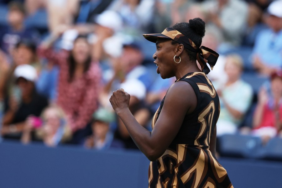 Venus Williams, of the United States, reacts with partner Leylah Fernandez, of Canada, during a third-round doubles match of the U.S. Open tennis championships, Monday, Sept. 1, 2025, in New York. (AP Photo/Heather Khalifa)