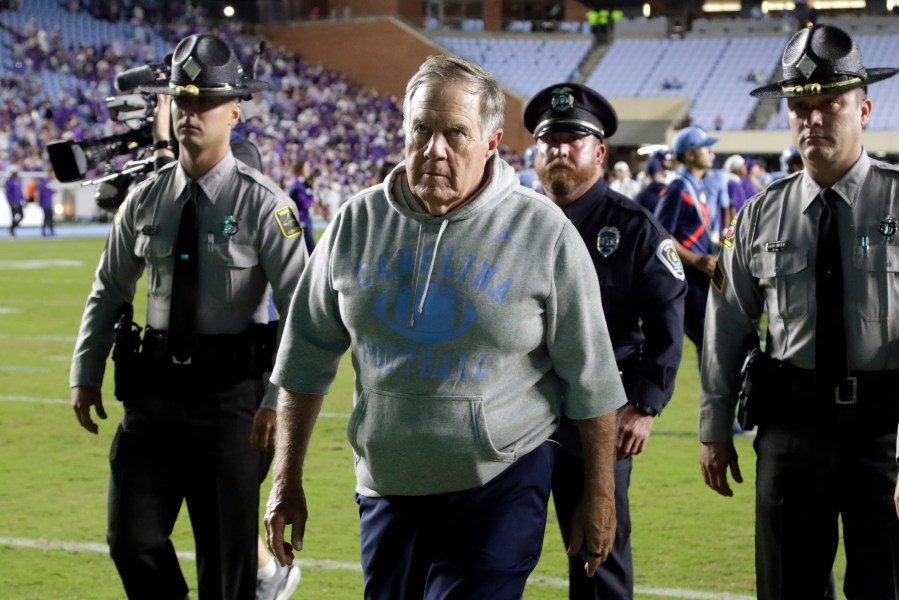 North Carolina head coach Bill Belichick, front, walks off the field after his team lost to TCU in an NCAA college football game Monday, Sept. 1, 2025, in Chapel Hill, N.C. (AP Photo/Chris Seward)