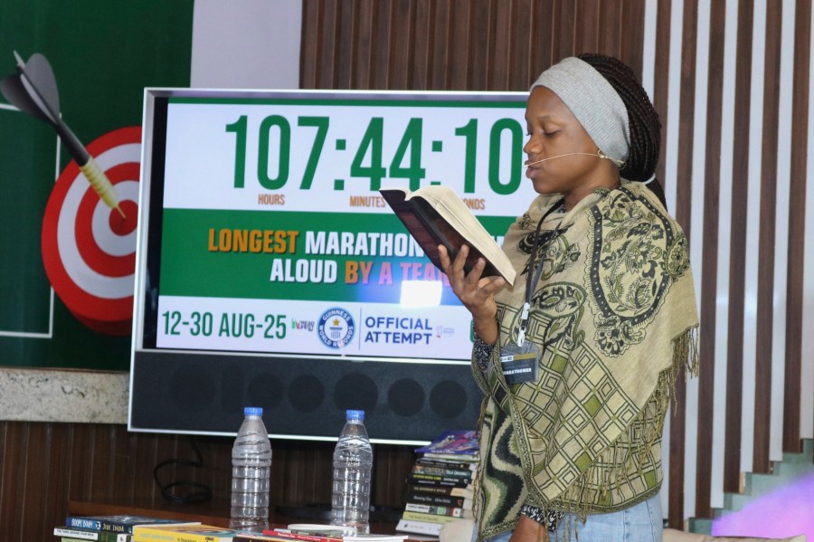 Preciouslight Ukachi, part of a team of five Nigerians who read aloud nonstop for over 400 hours in an attempt to break the Guinness world record, reads in Lagos, Nigeria, Saturday, Aug 30, 2025. (Alhamdu Monday/JLM Media via AP)