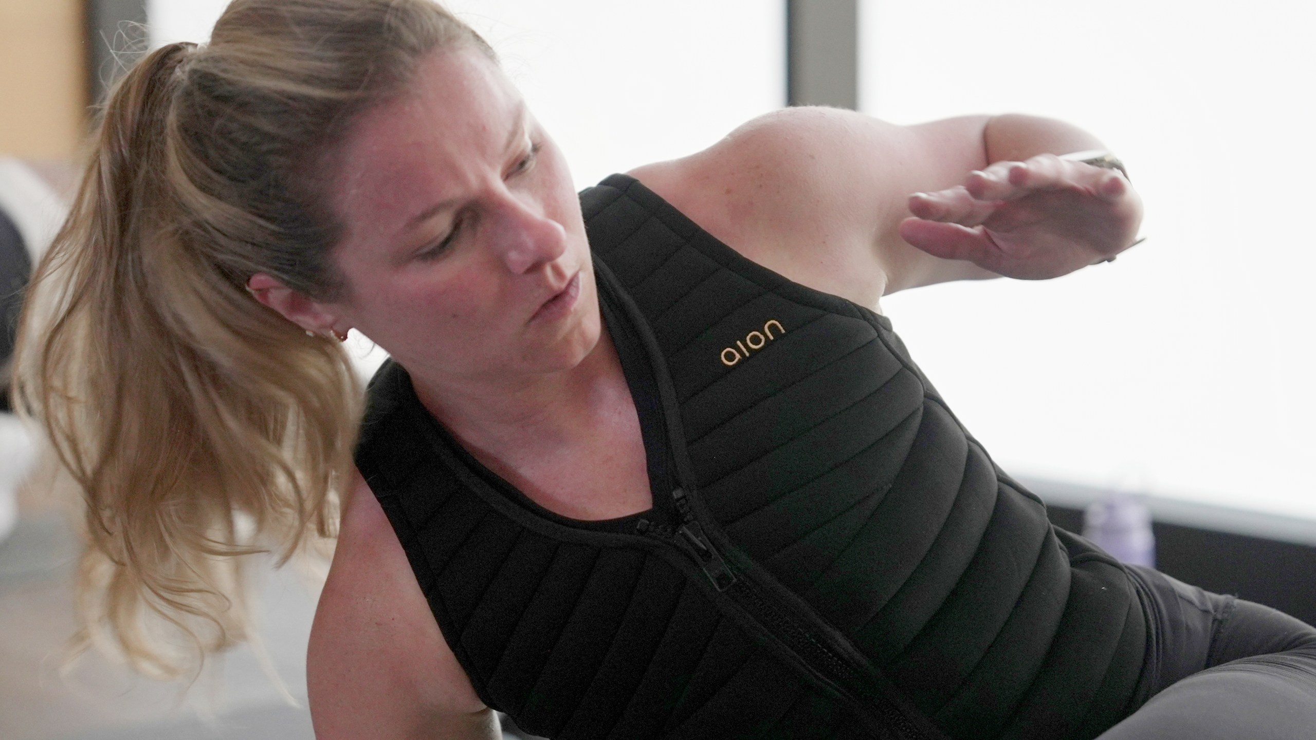 CORRECTS YEAR TO 2025, NOT 2024 - Nora Capocci wears a weighted vest during an MB360 workout class at the Life Time health club in New York on Wednesday, Aug. 13, 2025. (AP Photo/Shelby Lum)
