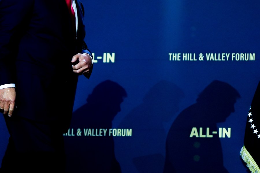 FILE - President Donald Trump walks to sign executive orders during an artificial intelligence summit at the Andrew W. Mellon Auditorium, July 23, 2025, in Washington. (AP Photo/Julia Demaree Nikhinson, File)