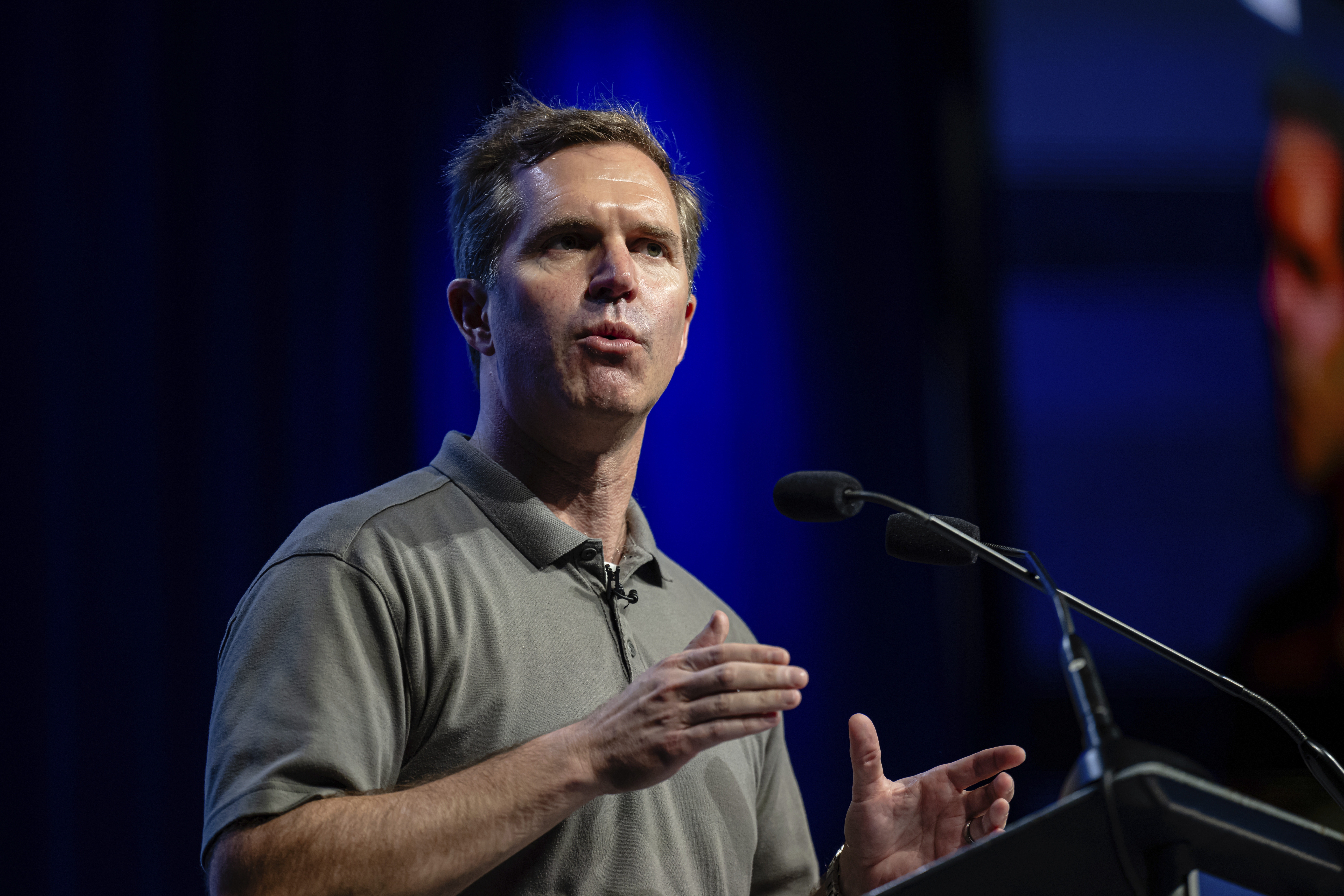 Kentucky Governor Andy Beshear speaks on stage at GE Appliances global headquarters, Wednesday, Aug 13, 2025, in Louisville, Ky. (AP Photo/Jon Cherry)