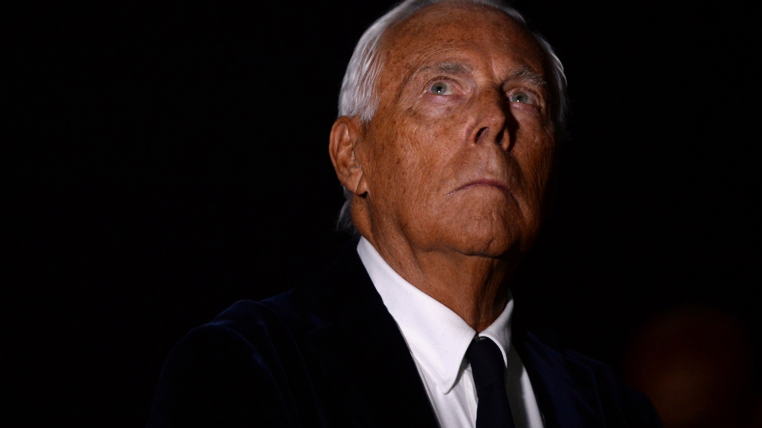 FILE - Italian designer Giorgio Armani attends his Haute Couture Fall Winter 2016/17 collection show in Moscow, Russia, April 14, 2016. (AP Photo/ Pavel Bednyakov, File)