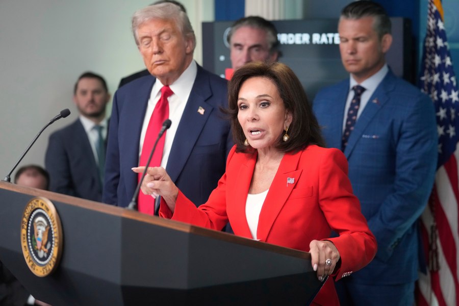 U.S. Attorney Jeanine Pirro speaks with reporters as President Donald Trump, from left, Interior Secretary Doug Burgum and Defense Secretary Pete Hegseth listen in the James Brady Press Briefing Room at the White House, Monday, Aug. 11, 2025, in Washington. (AP Photo/Mark Schiefelbein)