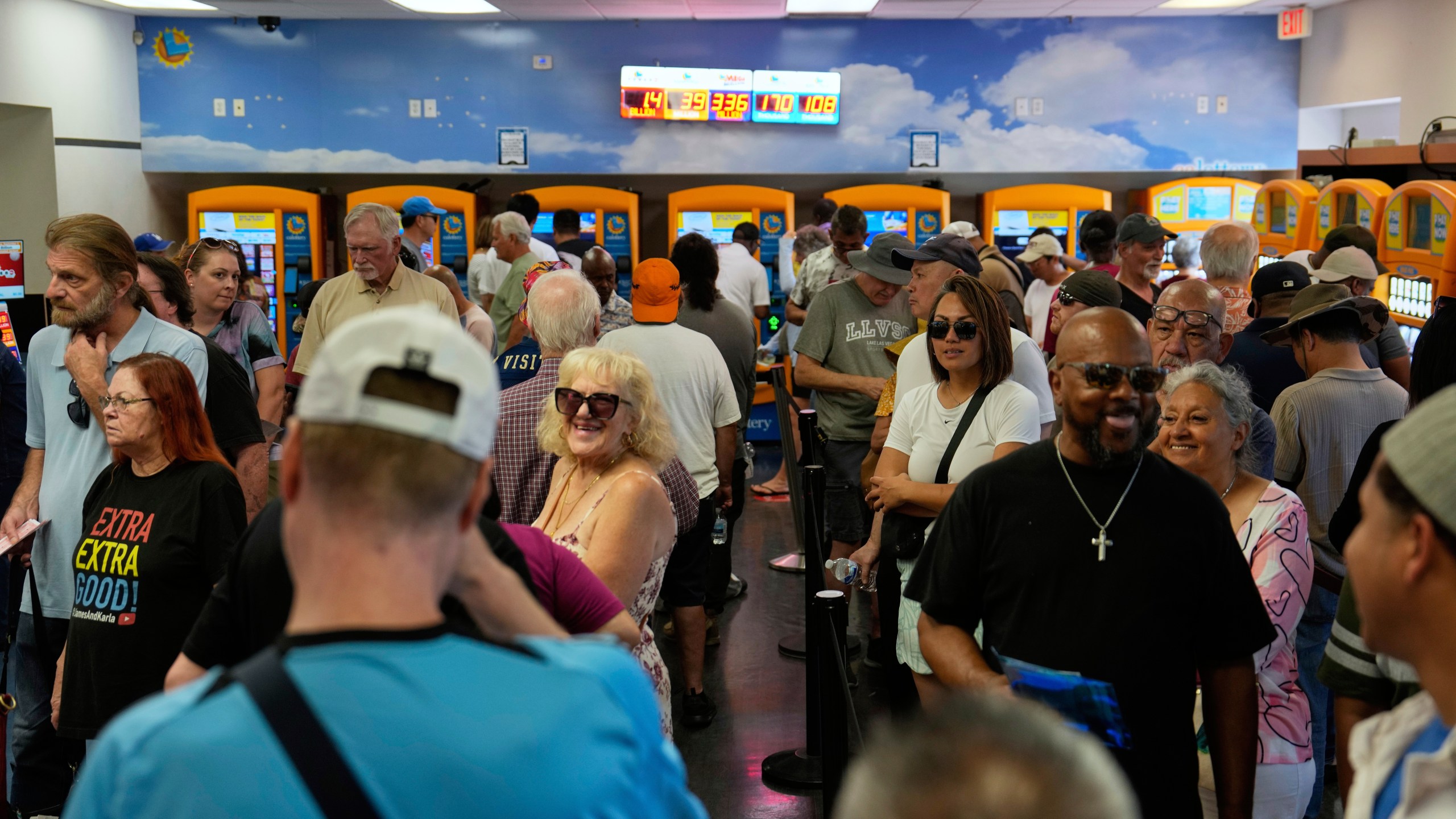 People wait in line to buy lottery tickets at the Lotto Store just inside the California border, Wednesday, Sept. 3, 2025, near Primm, Nev. (AP Photo/John Locher)
