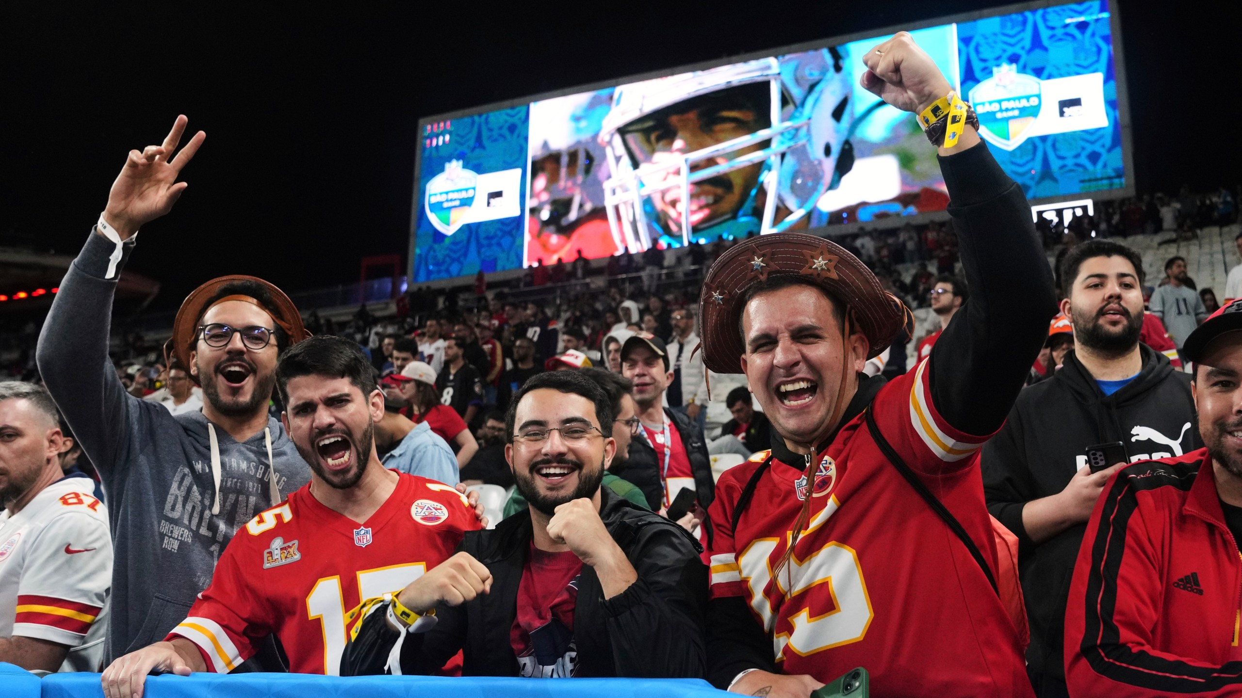 Fans cheer during warm ups before an NFL football game between the Kansas City Chiefs and the Los Angeles Chargers, Friday, Sept. 5, 2025, in Sao Paulo. (AP Photo/Fernando Llano)
