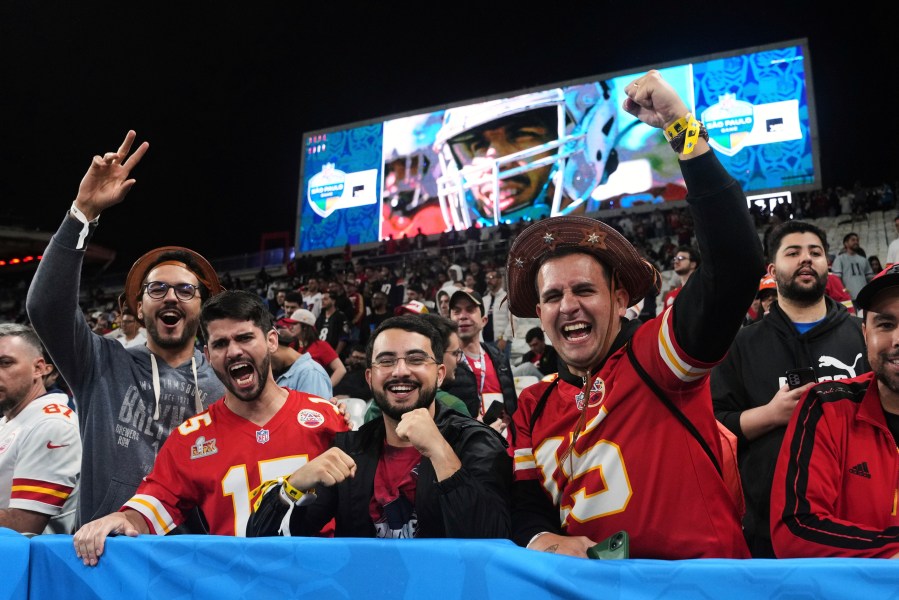 Fans cheer during warm ups before an NFL football game between the Kansas City Chiefs and the Los Angeles Chargers, Friday, Sept. 5, 2025, in Sao Paulo. (AP Photo/Fernando Llano)