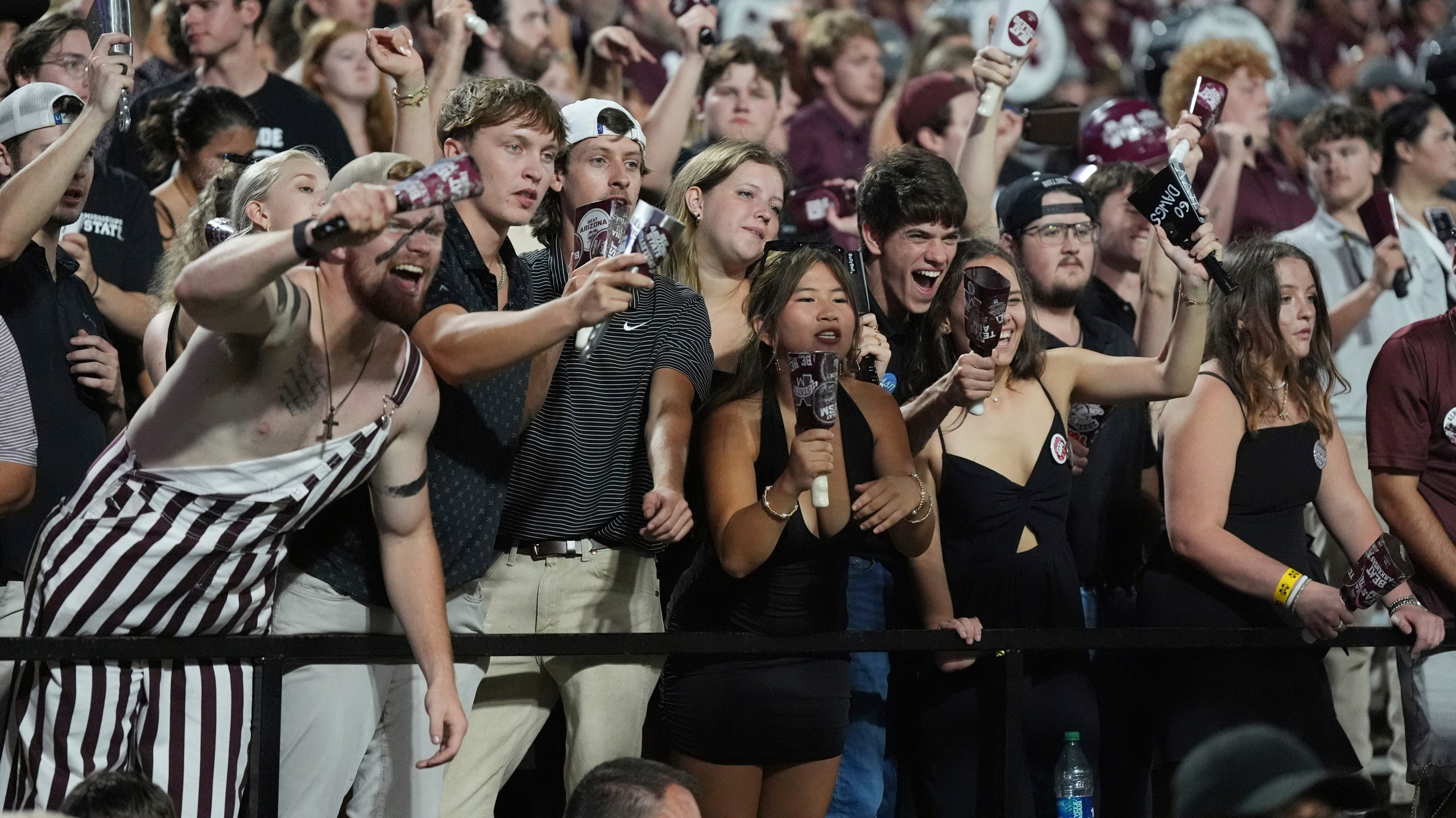 Mississippi State fans react to the team winning an NCAA college football game against Arizona State in Starkville, Miss., Saturday, Sept. 6, 2025. (AP Photo/Rogelio V. Solis)