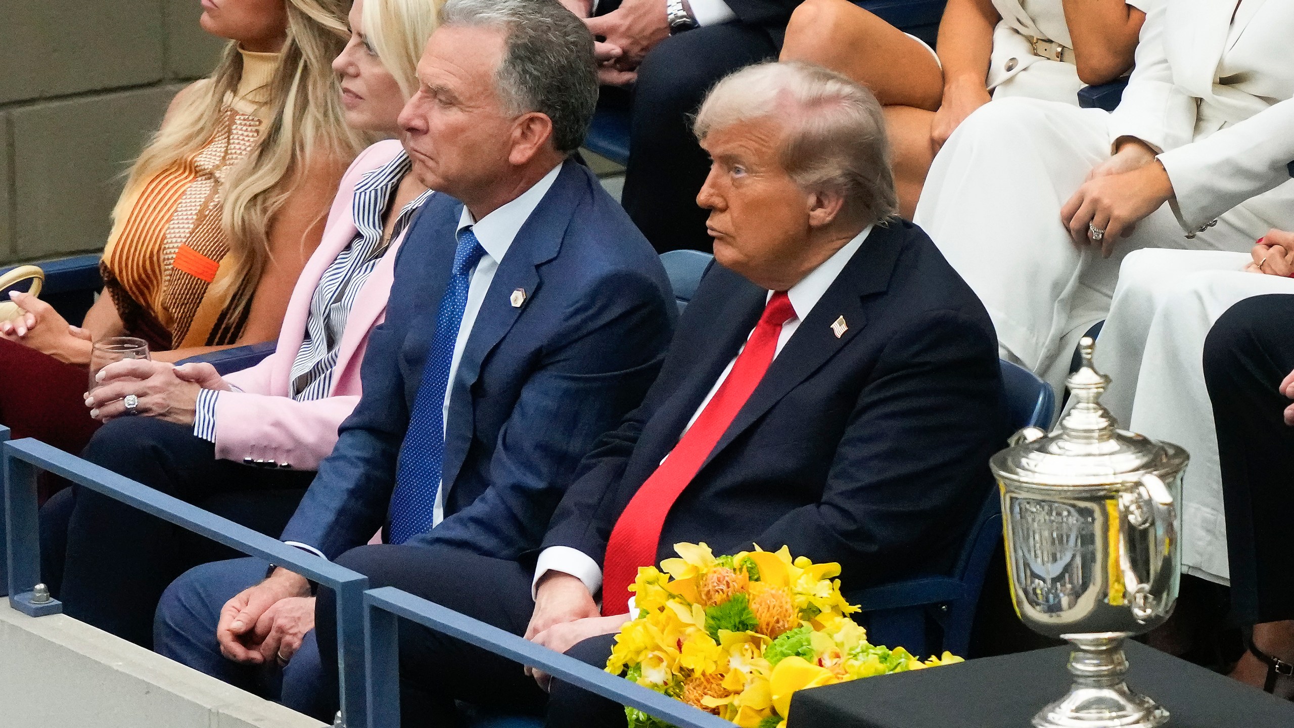 President Donald Trump, right, Steve Witkoff, center, and U.S. Attorney General, Pam Bondi, watch play between Carlos Alcaraz, of Spain, and Jannik Sinner, of Italy, during the men's singles final of the U.S. Open tennis championships, Sunday, Sept. 7, 2025, in New York. (AP Photo/Yuki Iwamura)