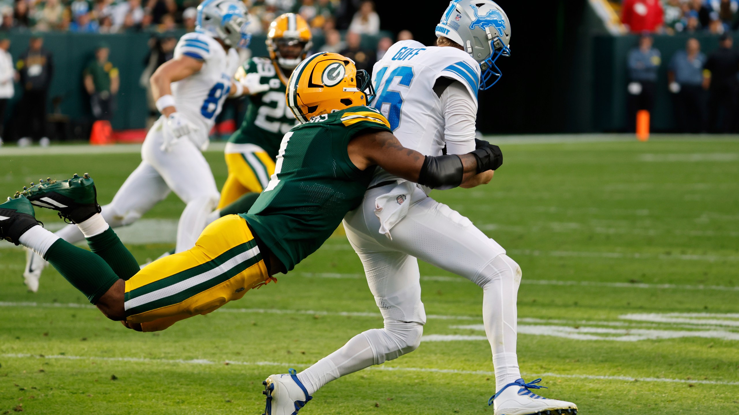 Green Bay Packers defensive end Micah Parsons (1) sacks Detroit Lions quarterback Jared Goff (16) during the second half of an NFL football game Sunday, Sept. 7, 2025, in Green Bay, Wis. (AP Photo/Mike Roemer)