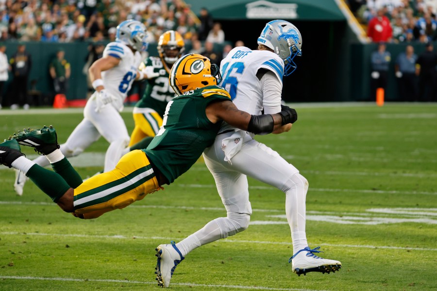 Green Bay Packers defensive end Micah Parsons (1) sacks Detroit Lions quarterback Jared Goff (16) during the second half of an NFL football game Sunday, Sept. 7, 2025, in Green Bay, Wis. (AP Photo/Mike Roemer)