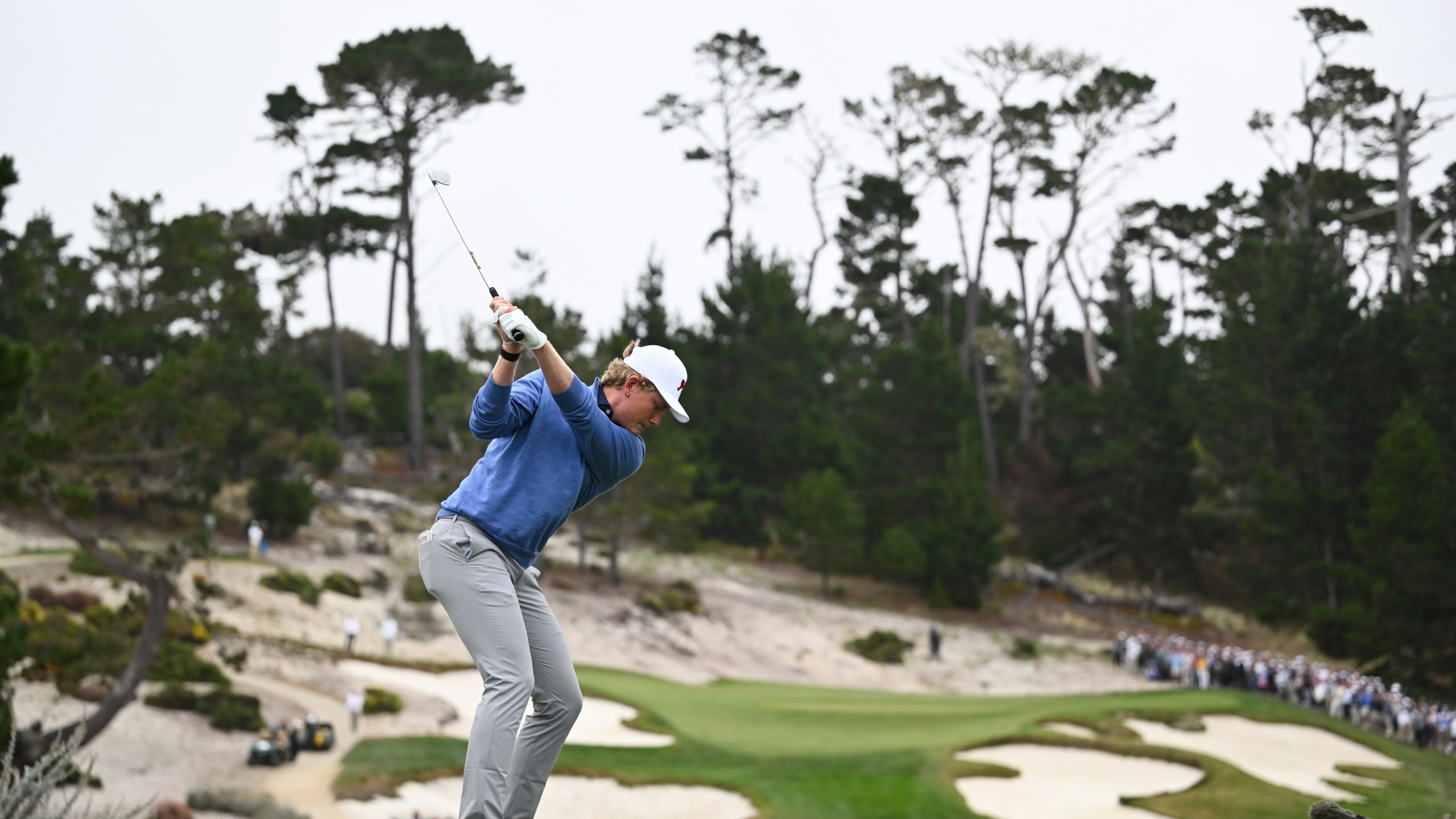 The Great Britain and Ireland team's Luke Poulter hits from the seventh tee during Walker Cup golf matches against the USA team at Cypress Point Club on Saturday, Sept. 6, 2025, in Pebble Beach, Calif. (AP Photo/Thien-An Truong)