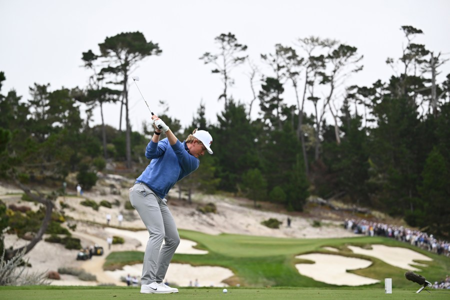 The Great Britain and Ireland team's Luke Poulter hits from the seventh tee during Walker Cup golf matches against the USA team at Cypress Point Club on Saturday, Sept. 6, 2025, in Pebble Beach, Calif. (AP Photo/Thien-An Truong)