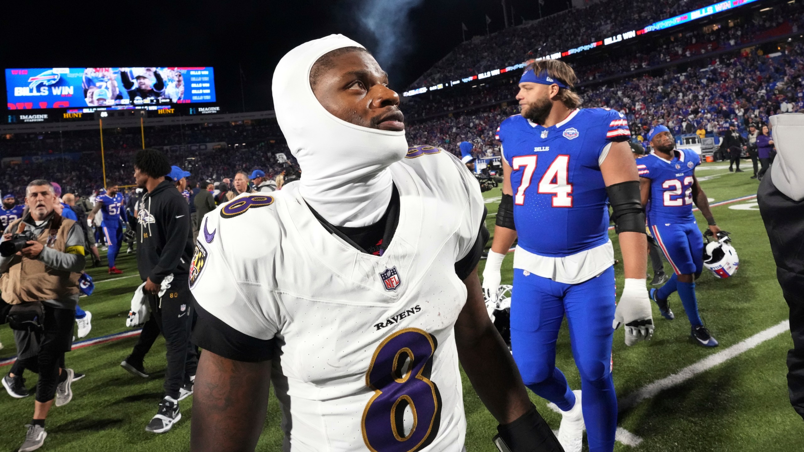 Baltimore Ravens quarterback Lamar Jackson (8) walks off the field after the team's loss to the Buffalo Bills in an NFL football game in Orchard Park, N.Y., Sunday, Sept. 7, 2025. (AP Photo/Gene J. Puskar)